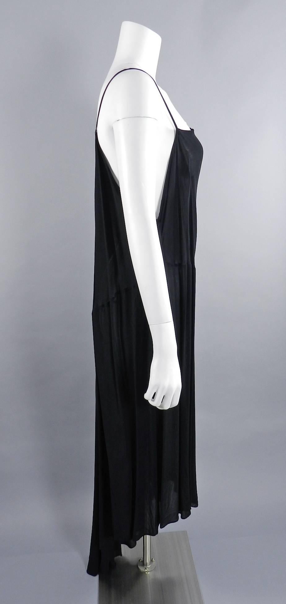 Yohji Yamamoto vintage circa late 1980’s sheer black long dress. 100% rayon.  Loose and free pull-over design with no zippers or fasteners.  Asymmetrical hemline, one strappy shoulder, and one low plunging side. Shoulder to hem of longest part of