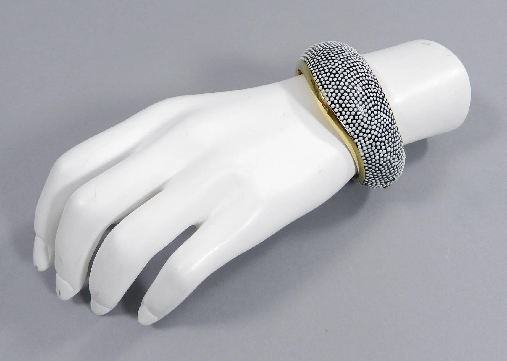 Tom Ford goldtone hinged cuff bracelet with black and white enamel. 18k yellow gold plated.  Made in Italy. Excellent condition. Size small. Measures 1.25” wide and 6.5” interior circumference. 

We ship worldwide.
