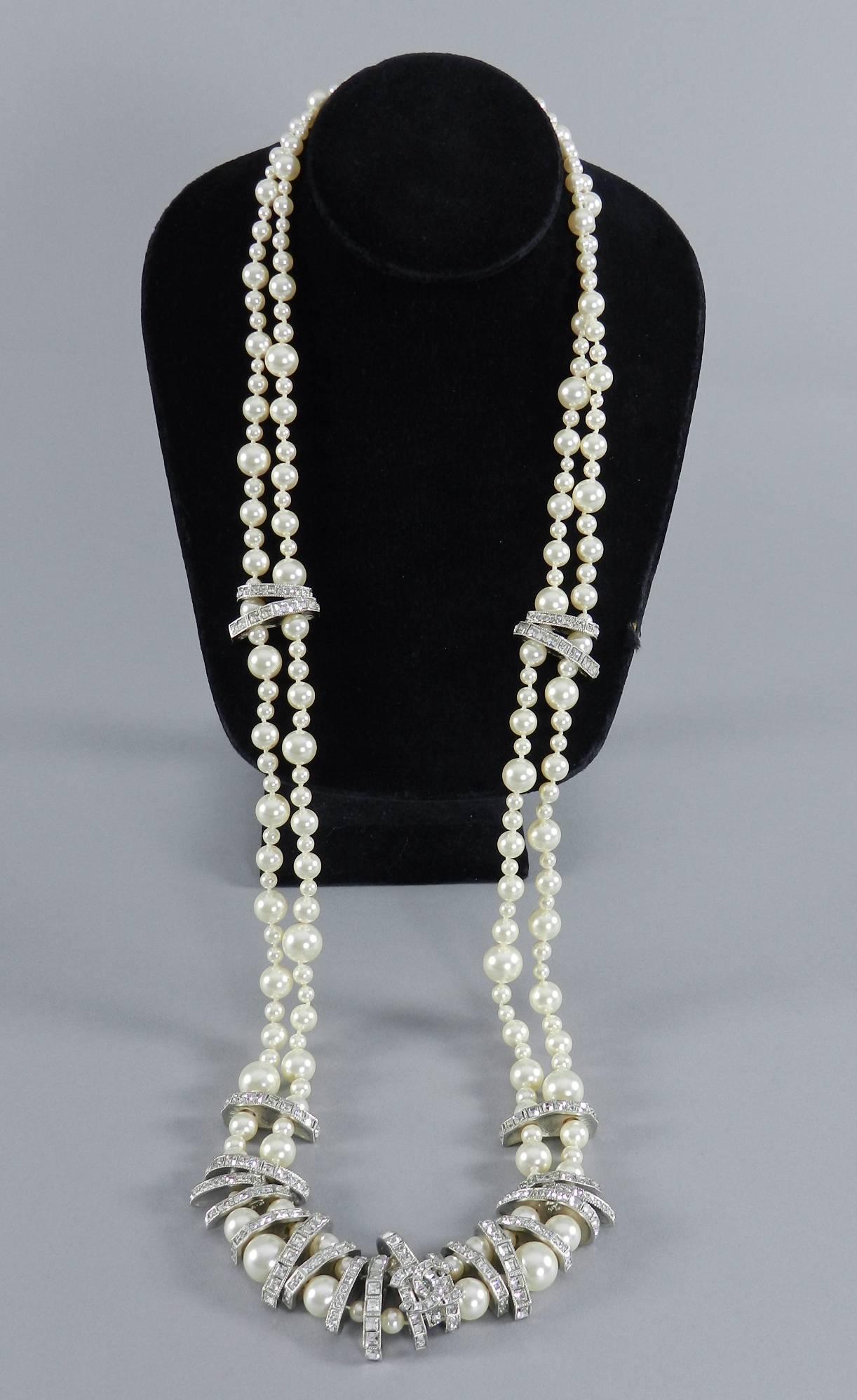 Chanel 15P long double strand pearl necklace with rhinestone spacers. Original box and black velvet pad. Excellent pre-owned condition - worn once if at all. Measures 33