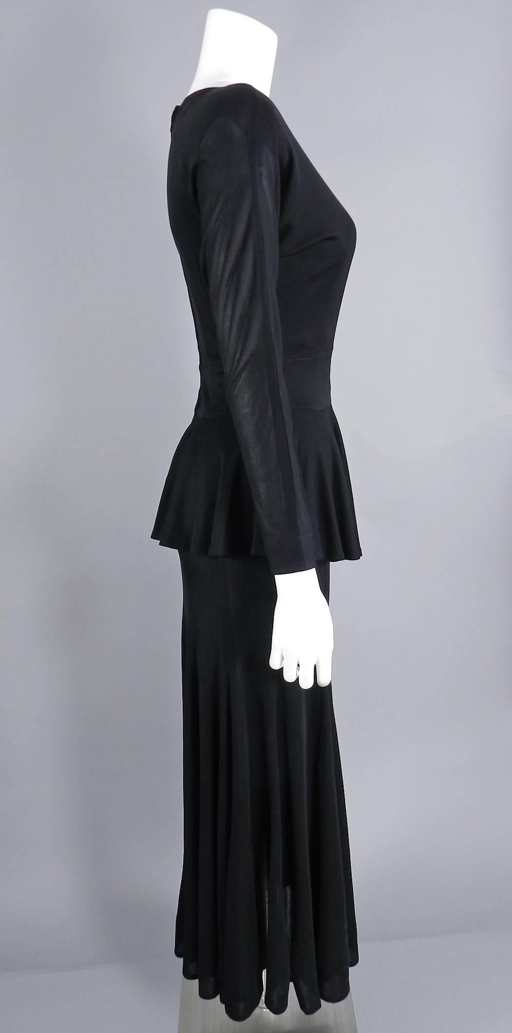 Jean Muir vintage circa early 1980's black rayon matte jersey dress. 1940's inspired peplum design, dolman sleeves, light shoulder pads, centre back zipper. Tagged size USA 8. Garment bust measures about 36