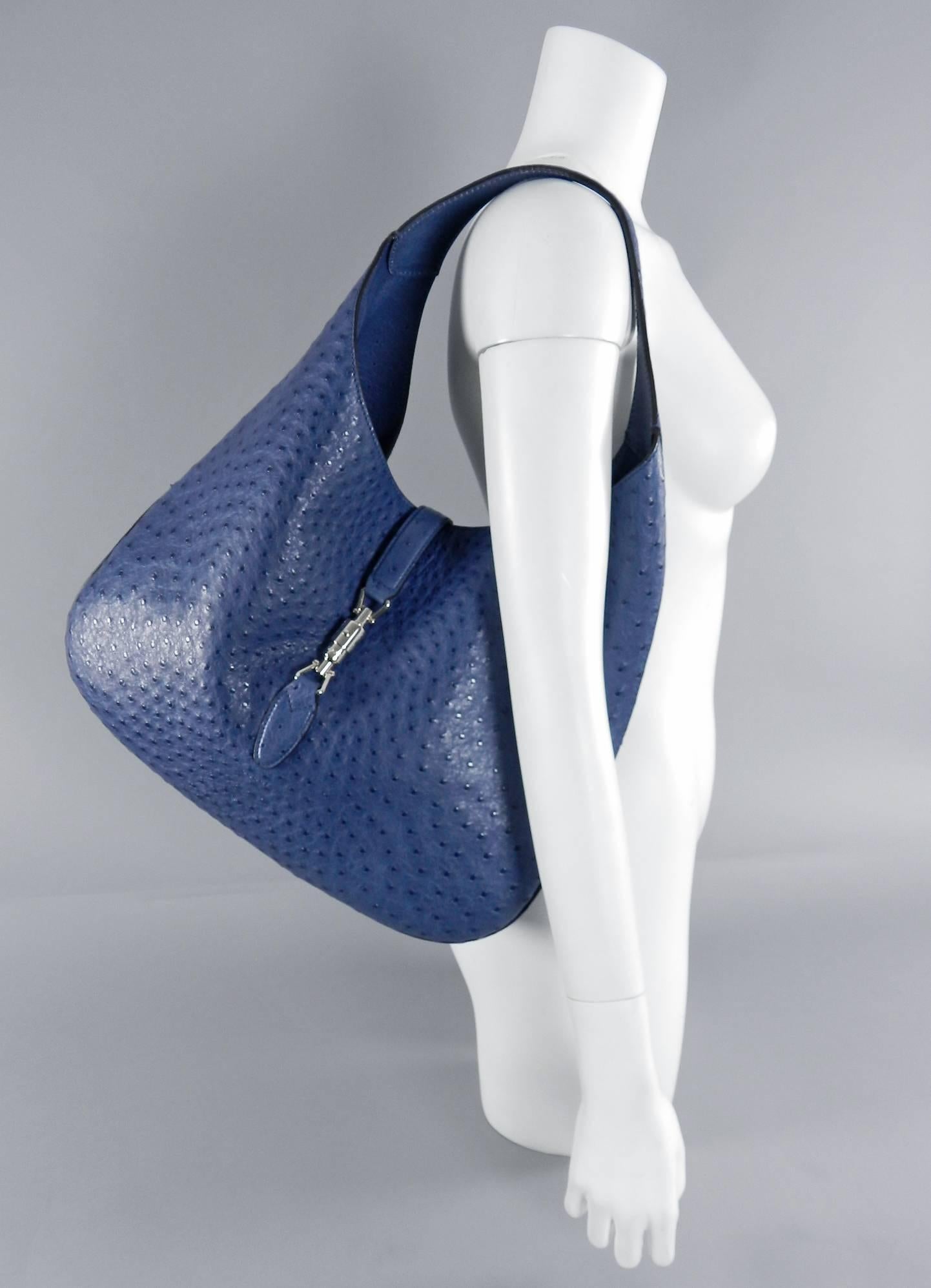 Gucci blue ostrich Jackie O bag - limited edition. Large size. Silver-tone piston closure, suede lined, small zippered pouch. Excellent pre-owned condition - used once. Includes duster, price tag, papers. Original retail price $10,975+. Body of bag