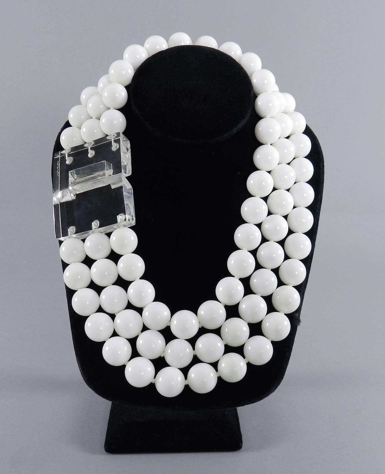 Patricia von Musulin triple strand beaded necklace with clear lucite clasp. 17mm white onyx beads. Shortest strand is about 17
