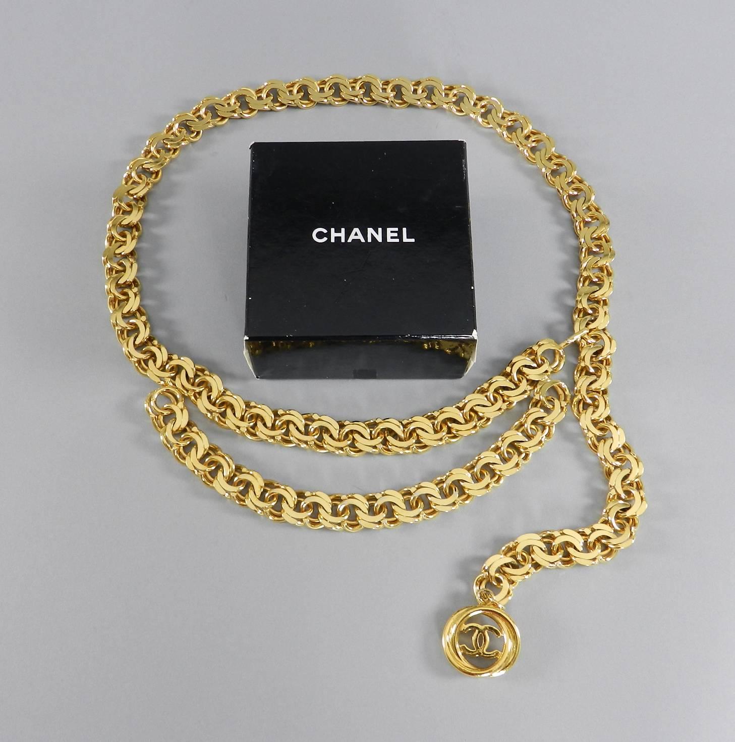 Chanel vintage spring 1987 gold chain belt. Heavy gilt chain design with CC medallion drop. Marked Chanel season 25 (spring 1987) Made in France. Comes with original box. Measures 40