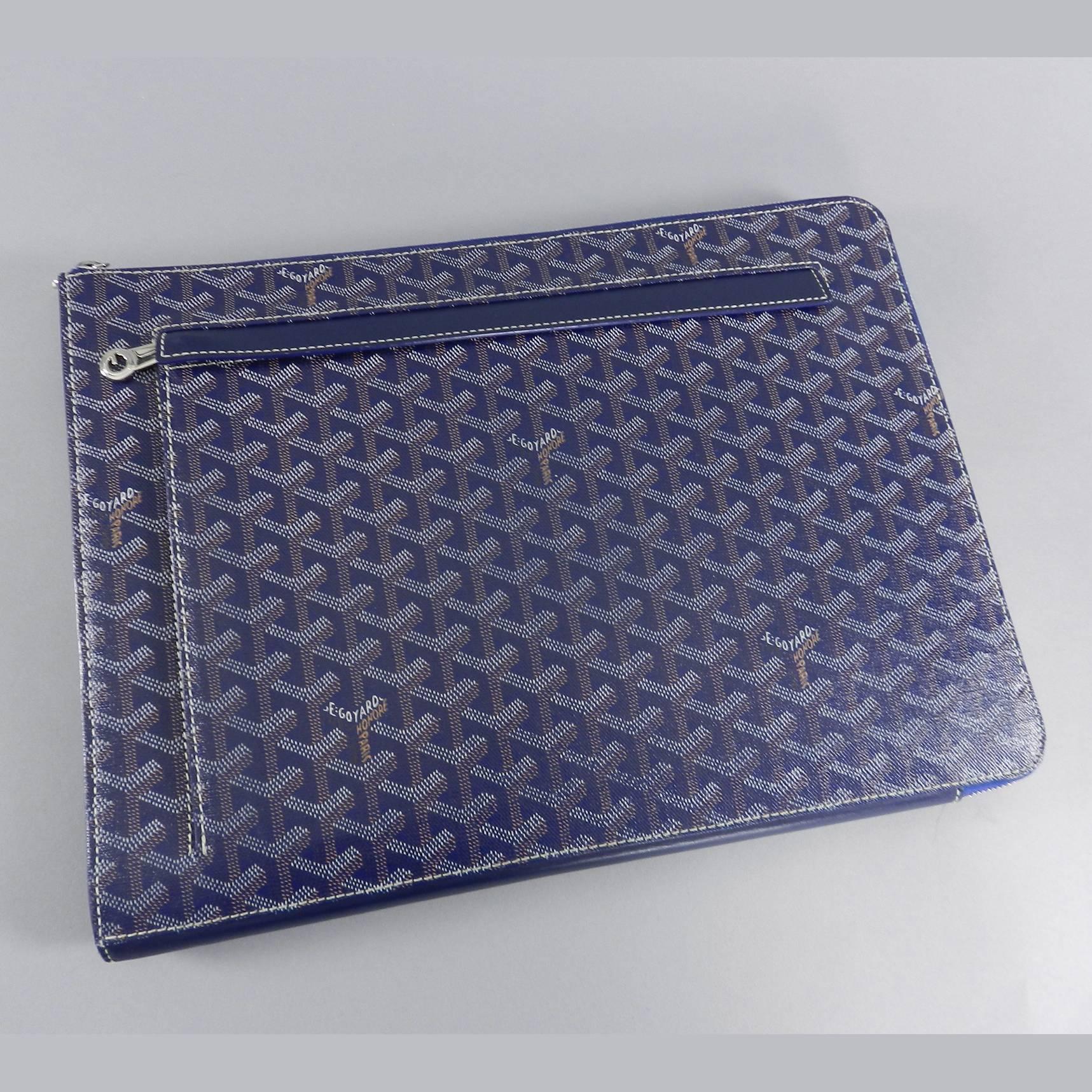 Goyard blue monogram canvas zippered portfolio bag. Silvertone metal hardware, one small zippered pocket on exterior, interior divider in yellow leather. Excellent pre-owned condition. Original owner purchased this in Japan. Measures 15