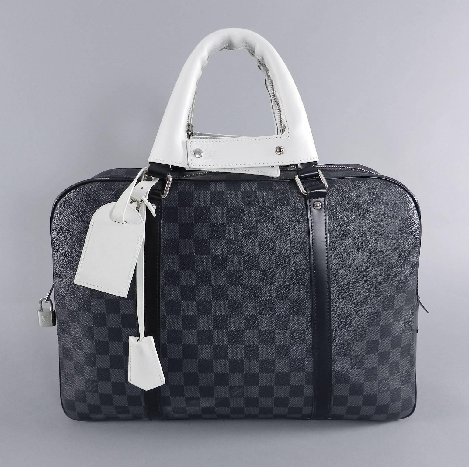Louis vuitton porte documents voyage travel bag. Dark grey and black daimer graphite canvas. Limited edition with white zip off handle covers, clochette, and ID tag. ID tag is monogramed with previous owner's initials. Comes with lock and 2 keys.
