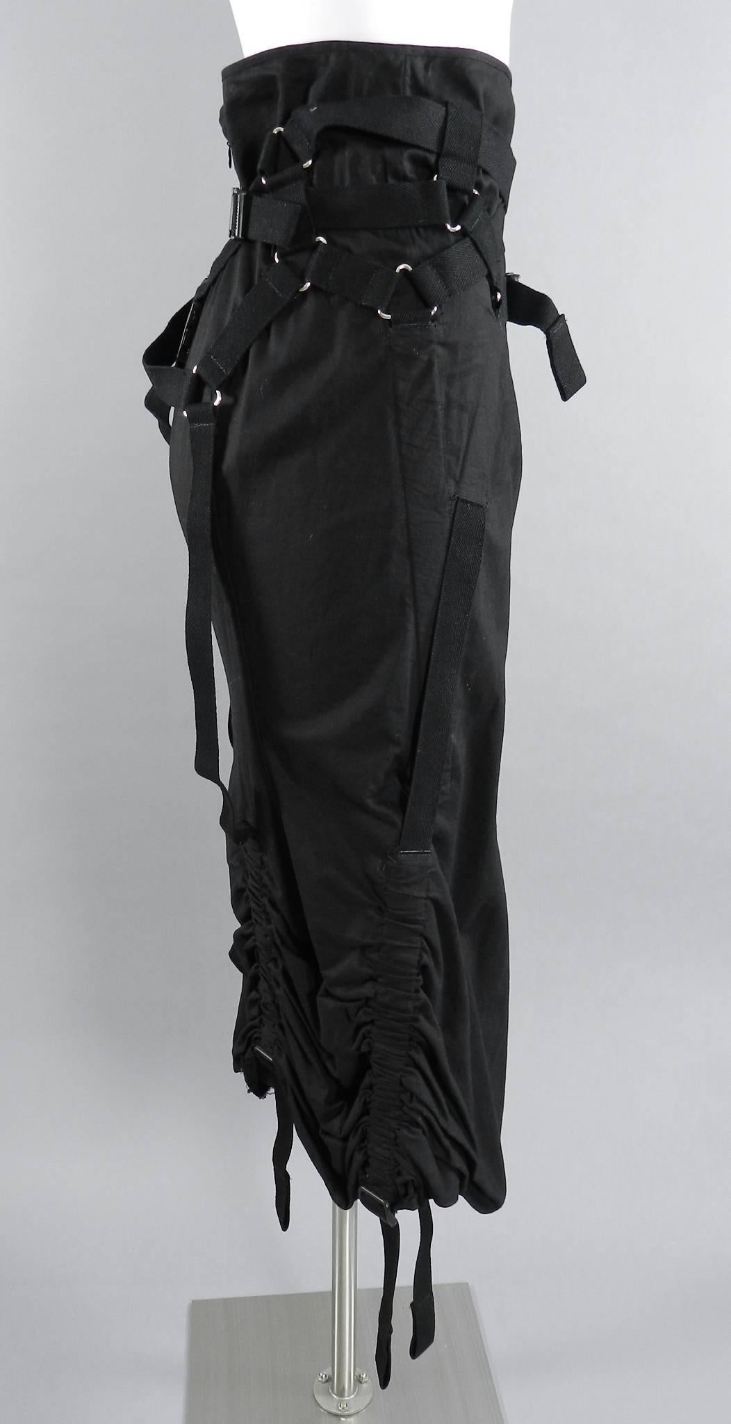 Junya Watanabe Comme des Garcons 2002 black parachute skirt. Long black cotton skirt with centre back zipper, straps and buckle design, ruched hem. Excellent condition. 100% cotton. Tagged size M but best for about USA size 4/6. Garment waist is 31