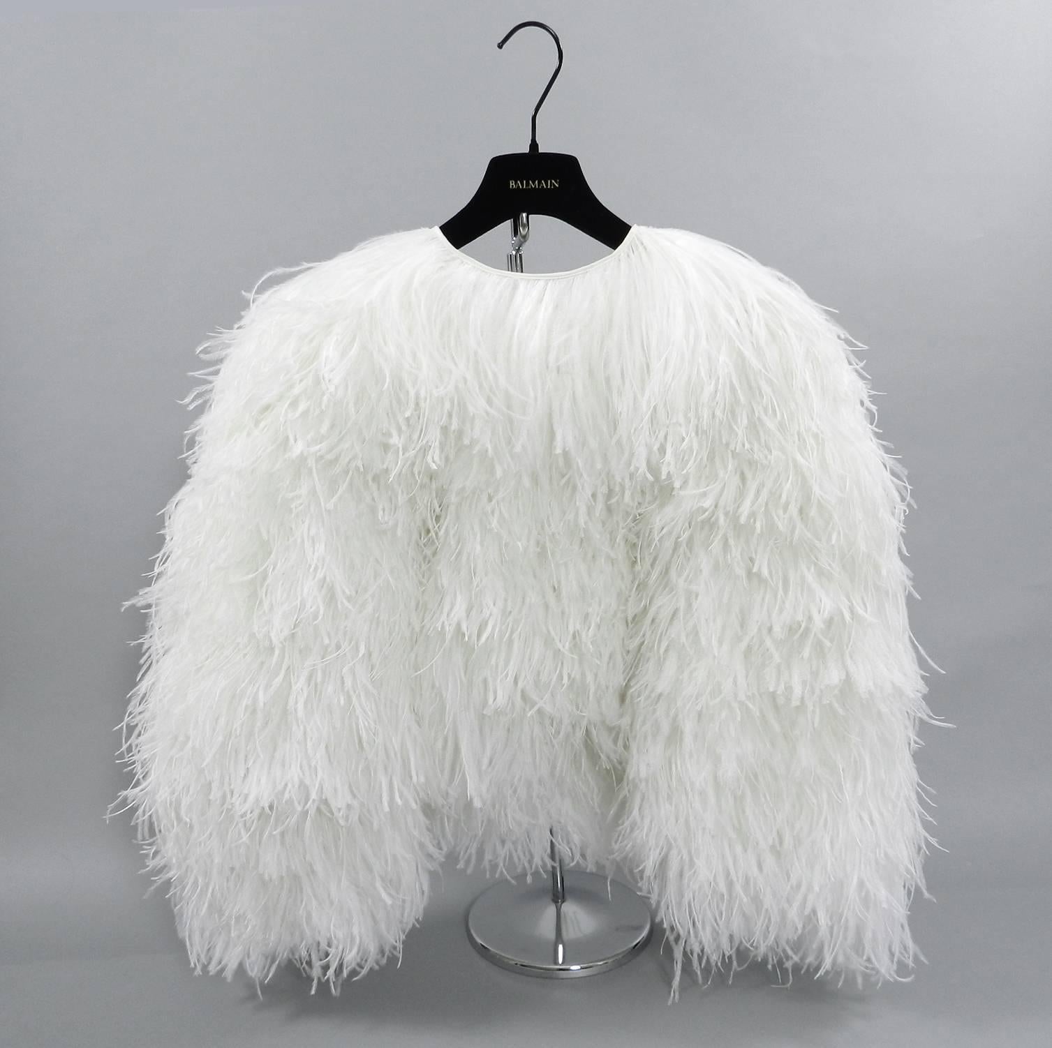 Balmain white ostrich feather evening jacket with gold zipper.  Can also be worn with zipper in back as a top. 100% silk body decorated with ostrich plumes.  Garment is tagged size FR 38 (USA 6).  Will fit 34