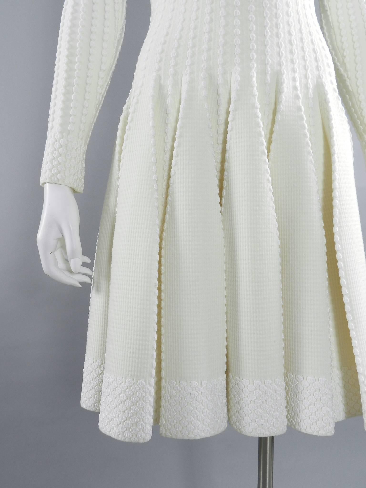 ALAIA Winter White / Ivory Long Sleeve Bodycon Fit and Flare Dress In Excellent Condition In Toronto, ON