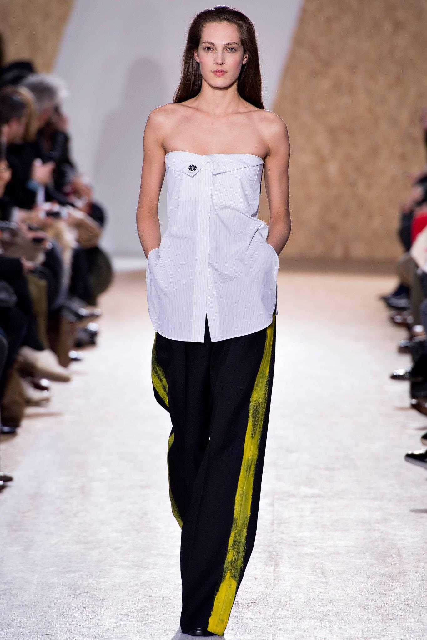 Maison Martin Margiela fall 2013 lead runway trousers and as seen on Miley Cyrus. Matching runway jacket available in a separate 1stdibs listing. Black wide leg design with high waist. Side hip pockets, pleated at waist. Yellow painted design down
