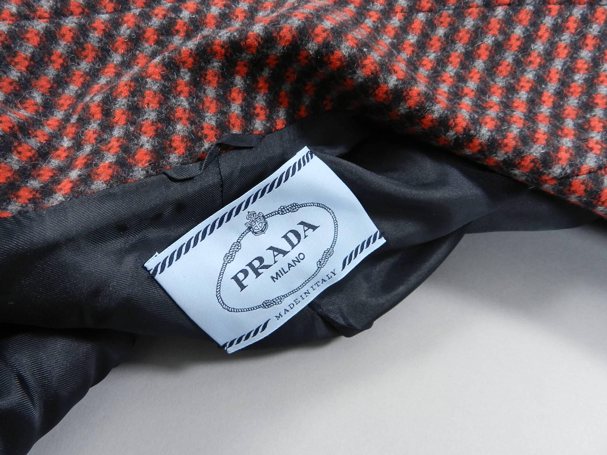 Prada fall 2014 red, grey, black wool blazer jacket. Fastens with one button at front waist, has front pockets, and 1970's inspired design. Excellent clean pre-owned condition - worn once - like new. Tagged size IT 40 (best for USA 4/6). To fit 34