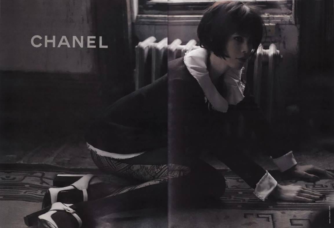 Chanel 2008 fall runway and ad campaign black wool jacket. Detachable silk collar, cuffs, and bustle. Tagged size FR 38 (USA 6). Garment bust measures 36