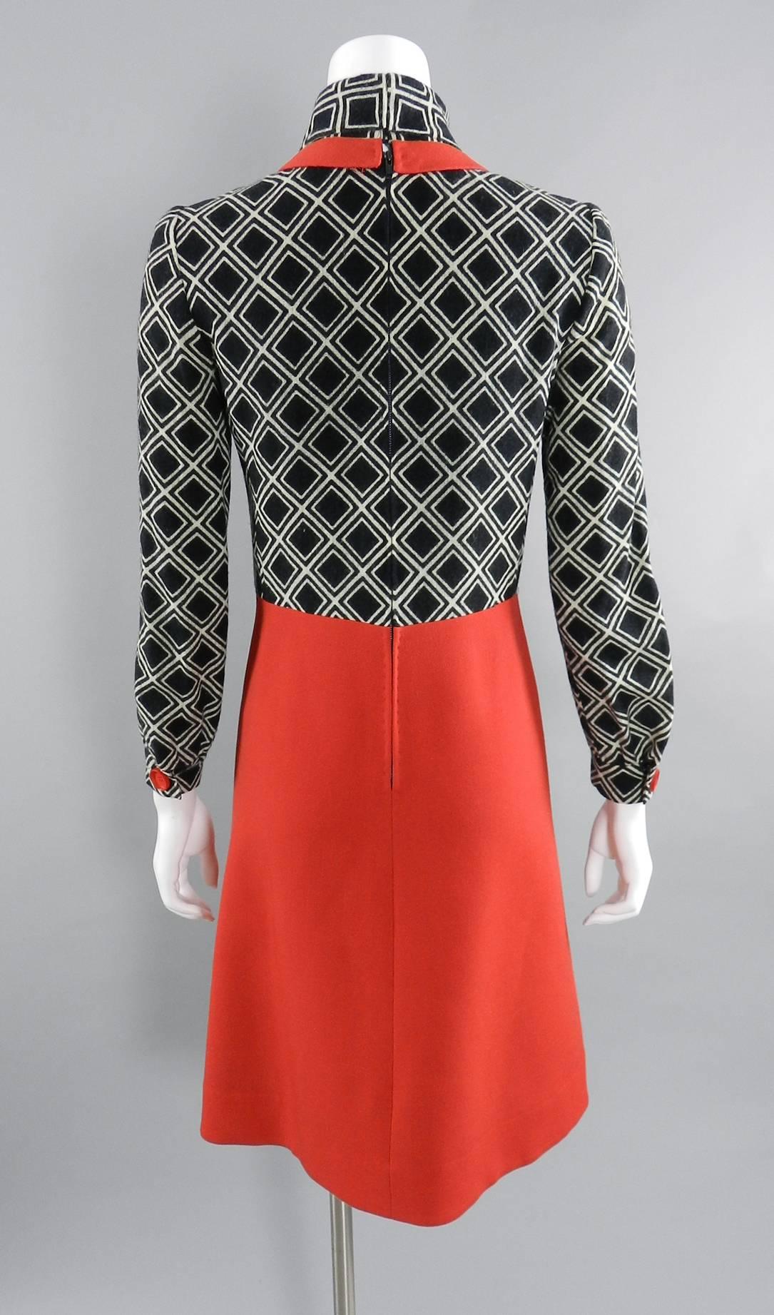 Vintage 1960's Antonio Castillo graphic mod black and red dress.  Wool with centre back zipper, turtleneck, buttons at cuffs, a-line skirt. Castillo worked at Lanvin from 1950-1962 and then opened his own house in 1964. This dress is approximately a