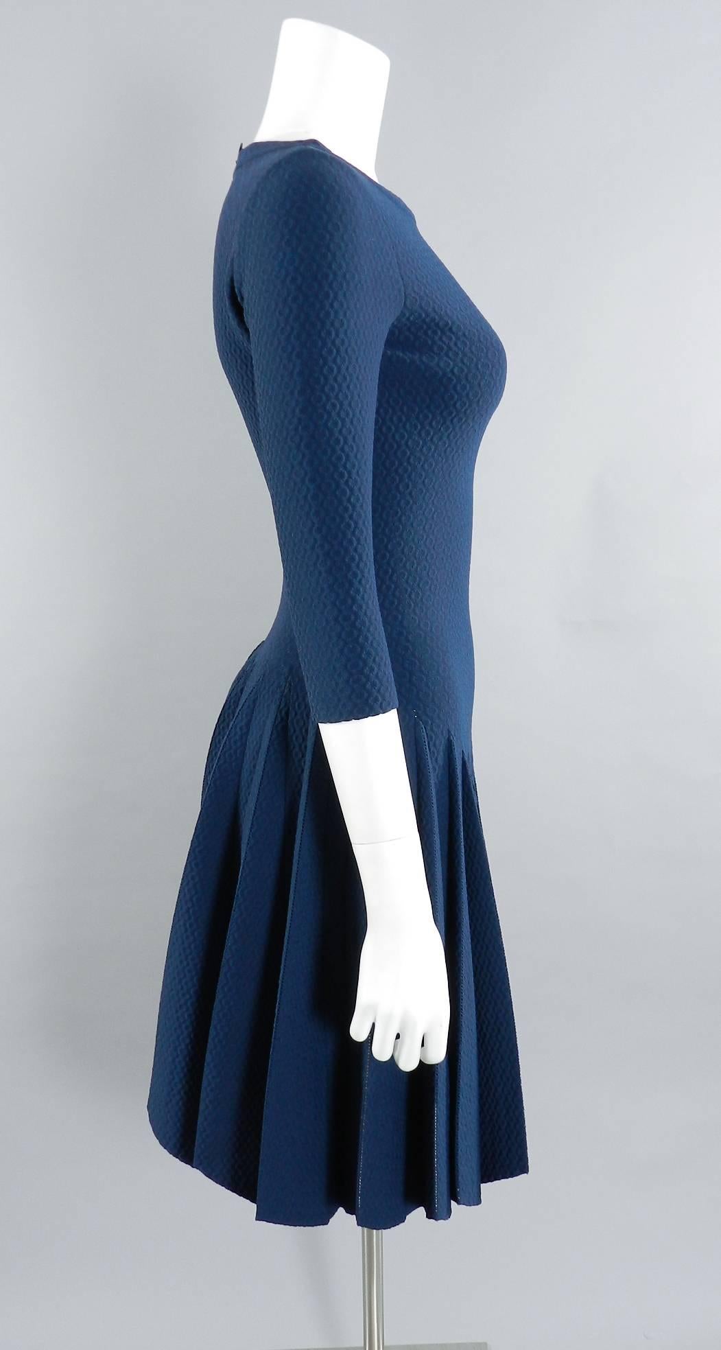 Azzedine Alaia prussian blue fit and flare knit jersey dress. Boatneck design with bracelet length sleeves and pleated skirt. Brand new with original retail price tag of $5795+ and never worn. Tagged size FR 38 (USA 6) but Alaia runs small and this