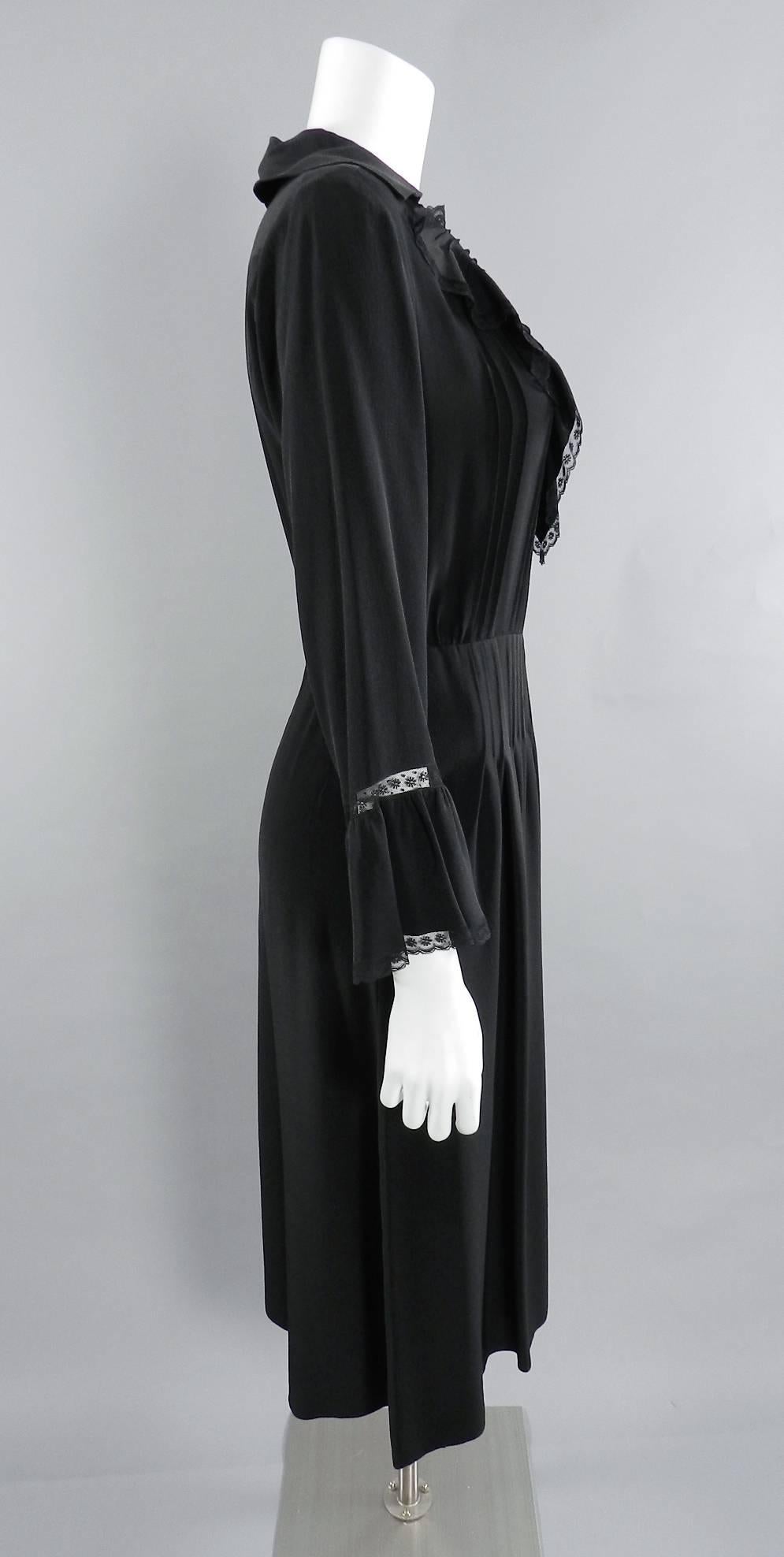 Vintage 1970's Chloe by Karl Lagerfeld Black Silk Ruffle Dress.  Centre back zipper, hidden side hip pockets, ruffle sleeves and neckline. Excellent vintage condition. About a USA 8. Garment bust measures 36