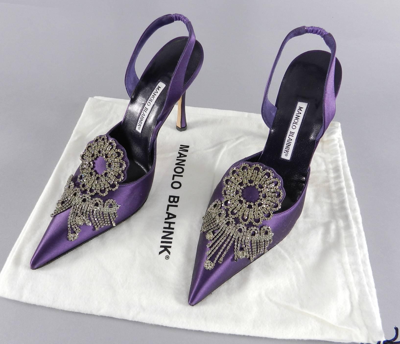 Manolo Blahnik Royal Purple Silk Satin and Rhinestone slingback Shoes.  Size 41. Pointy toe design with ornate jewelled prong-set rhinestones. Brand new and never worn. Original owner had anti-slip grips put on bottom. 4.75