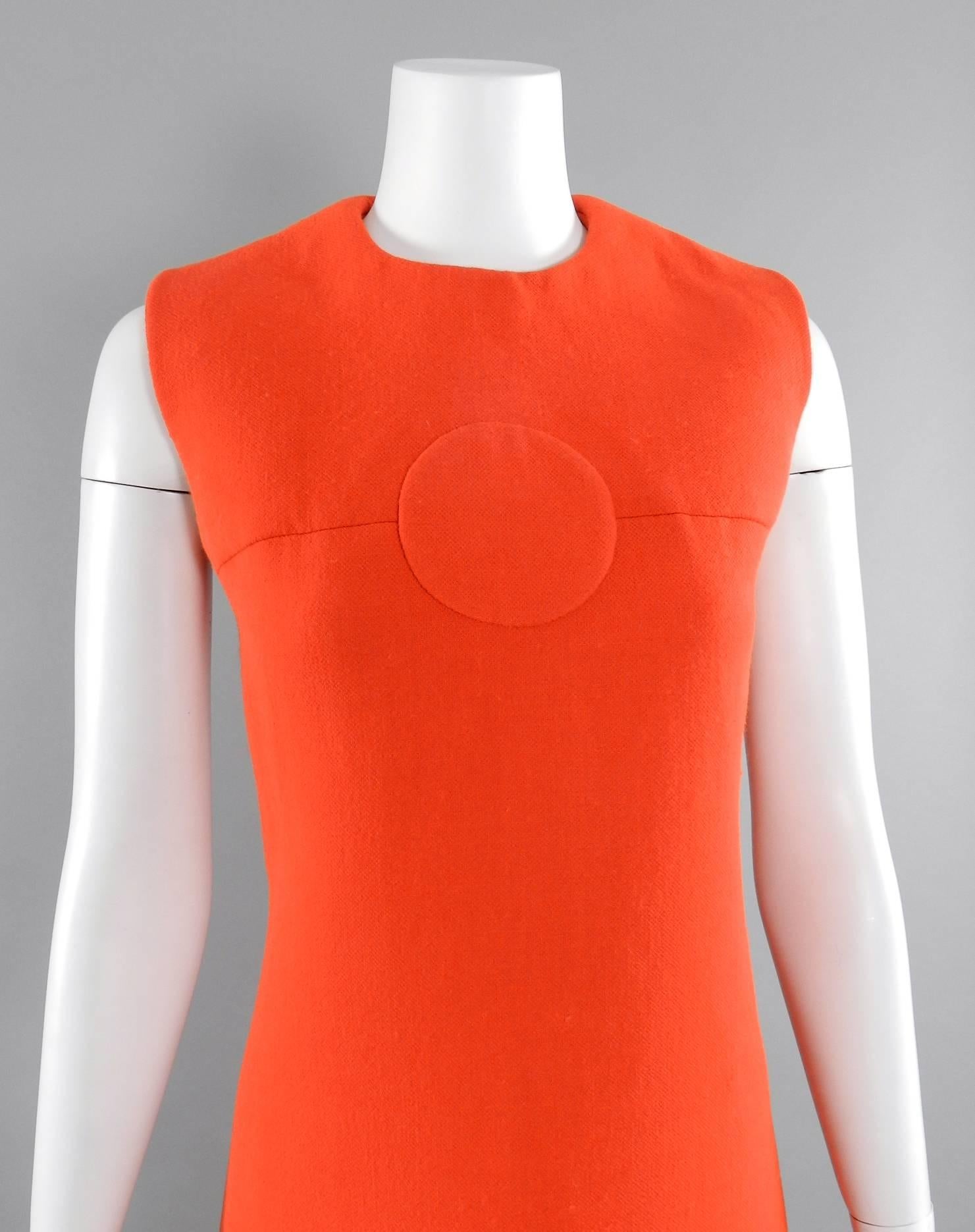 Pierre Cardin vintage late 1960's orange wool mod dress. Centre back zipper, sleeveless design, op-art circular inset at front neck, banding at dress hem. Fully lined. Excellent drycleaned vintage condition. Overall approximate modern size USA 8/10.