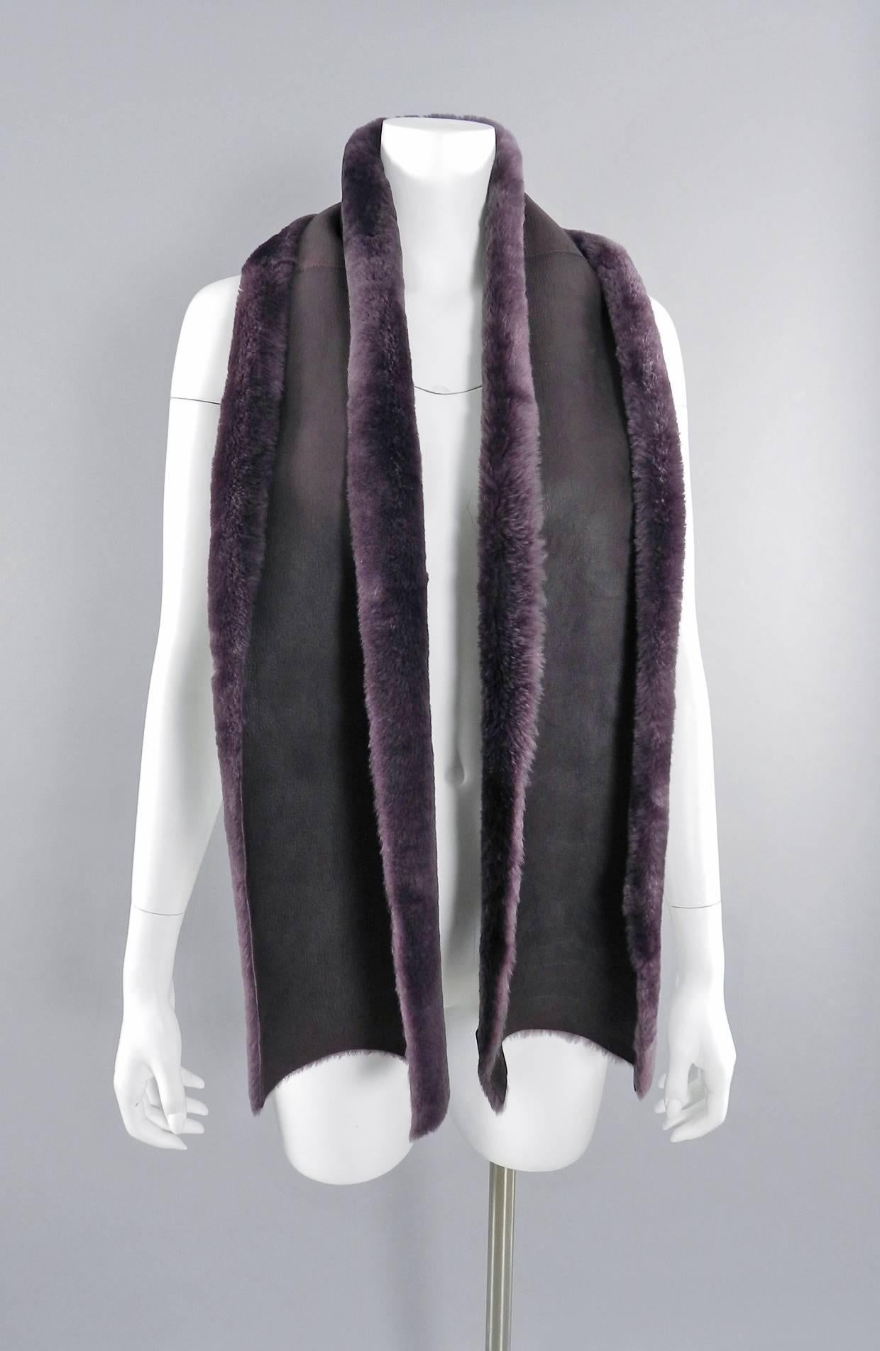 Chanel purple shearling lambskin scarf. Excellent pre-owned condition. Measures 8-10