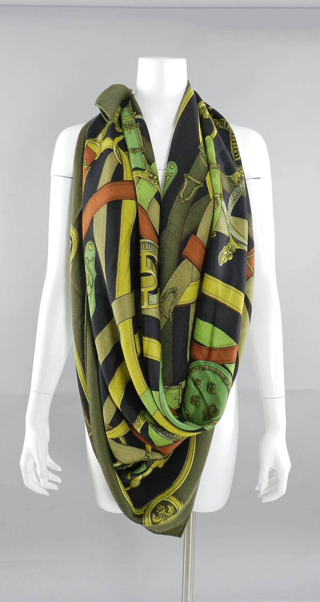 Hermes Cavalcadour by H. D. Origny. Cashmere silk 140cm shawl scarf - olive, black, lime, brown. Excellent pre-owned condition.  65% cashmere 35% silk blend. No box. 

We ship worldwide.