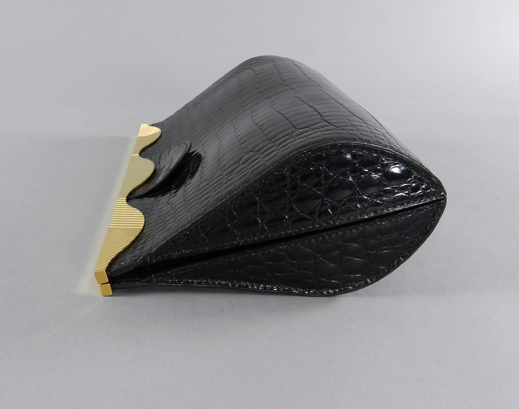 Hermes Vintage 1998 Limited Edition Black Crocodile Clutch with Gold Frame.  Sleek Art Deco design with scalloped 18k gold plated metal frame and glazed crocodile skin. Porosus crocodile marked ^.  Date stamp B in square for 1998.  Measures 23.5 x