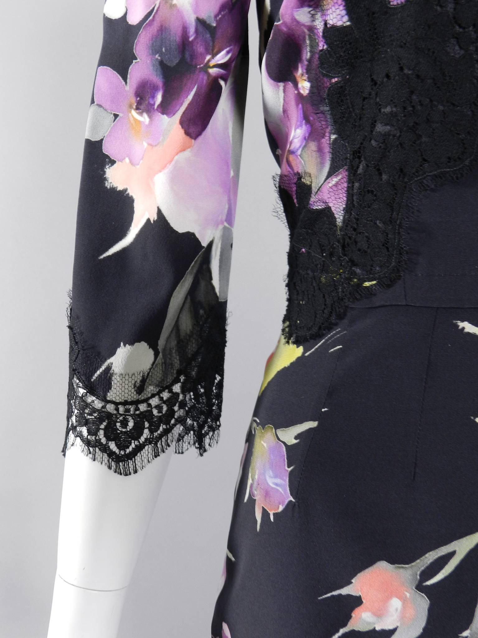 Dolce and Gabbana purple and red roses silk wiggle dress with black lace detail.  New with tags.  Centre back zipper, 3/4 length bracelet sleeve, lined. Tagged size IT 42 (USA 6).  Tof ti 34/35" at bust, 28-29" at waist and 38" hip.