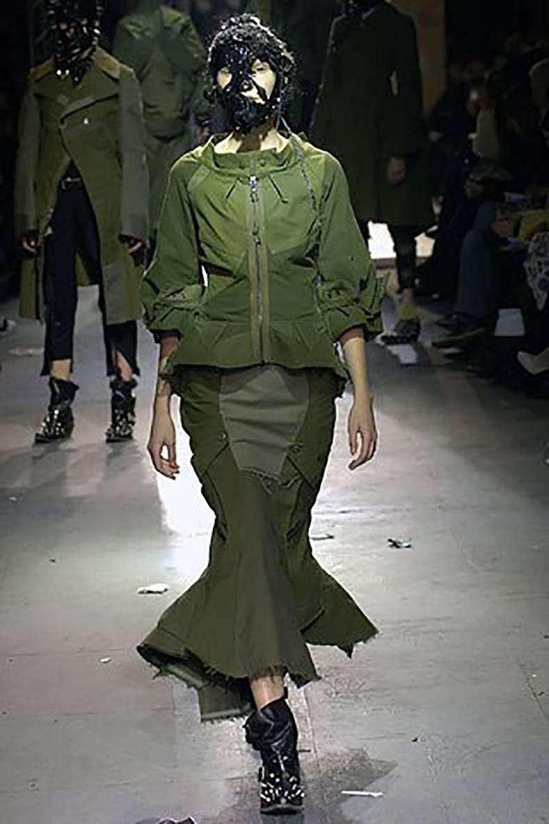 junya watanabe comme des garcons fall 2006 Deconstructed Army skirt.  Runway photos shown are for inspiration from same season and not of the skirt pictured. Tagged size SS but this fits much largest and is a USA 6/8.  Measures 28-29