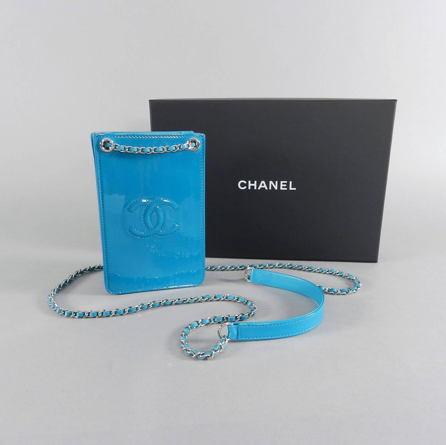 Chanel 14P Runway Turquoise Patent Crossbody Phone Case / Bag.  Excellent pre-owned condition - used once if at all - like new - with box, duster, retail purchase receipt from Chanel, and papers (original owner lost the black plastic authenticity