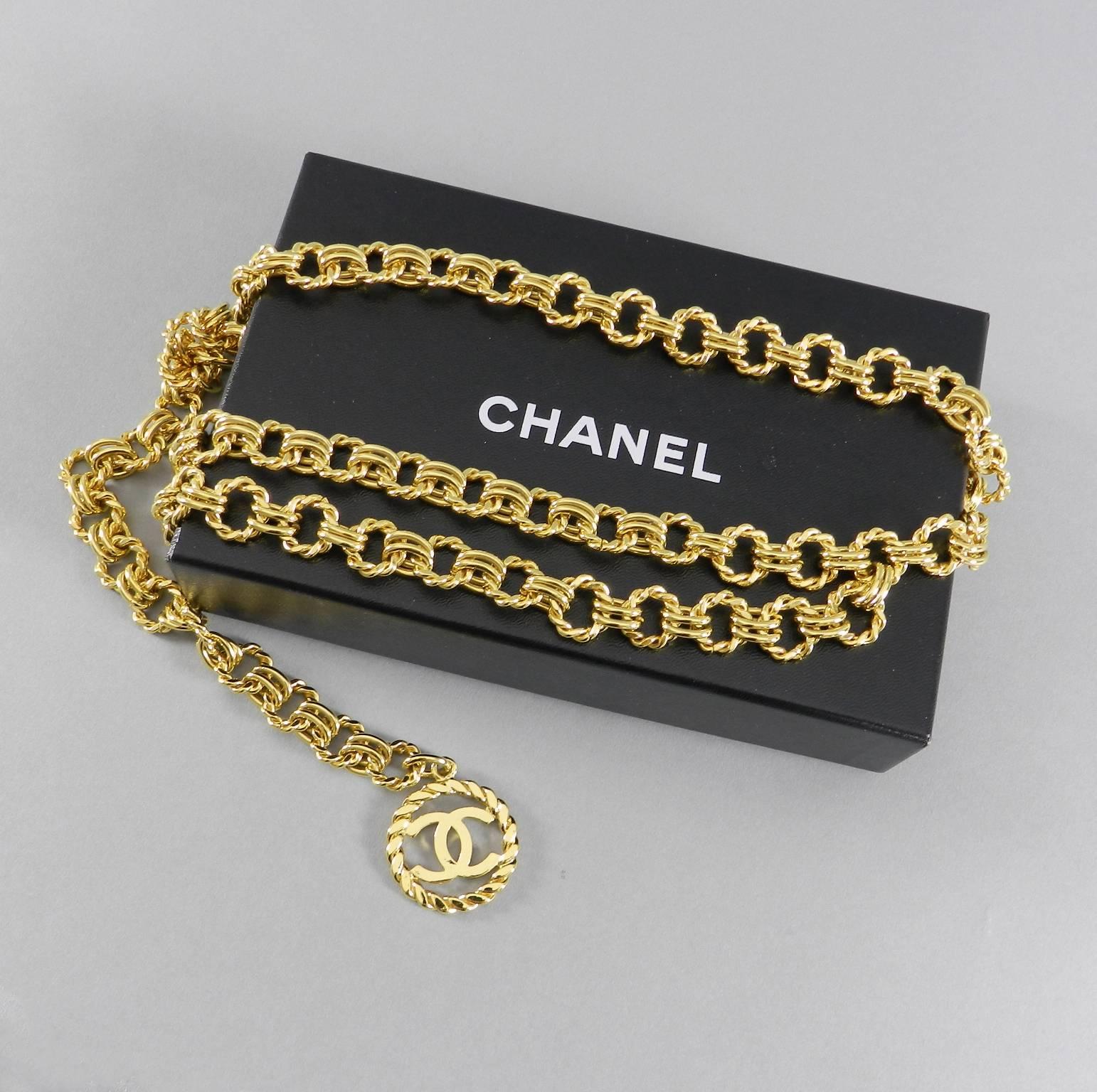 Chanel vintage 1991 gold chain belt.  Large CC logo medallion drop. Signed Chanel and season code 26 (1991) on small metal tab. Looks to be unworn and stored. Excellent shiny clean condition - like new. Fastens with hook anywhere along the 36"