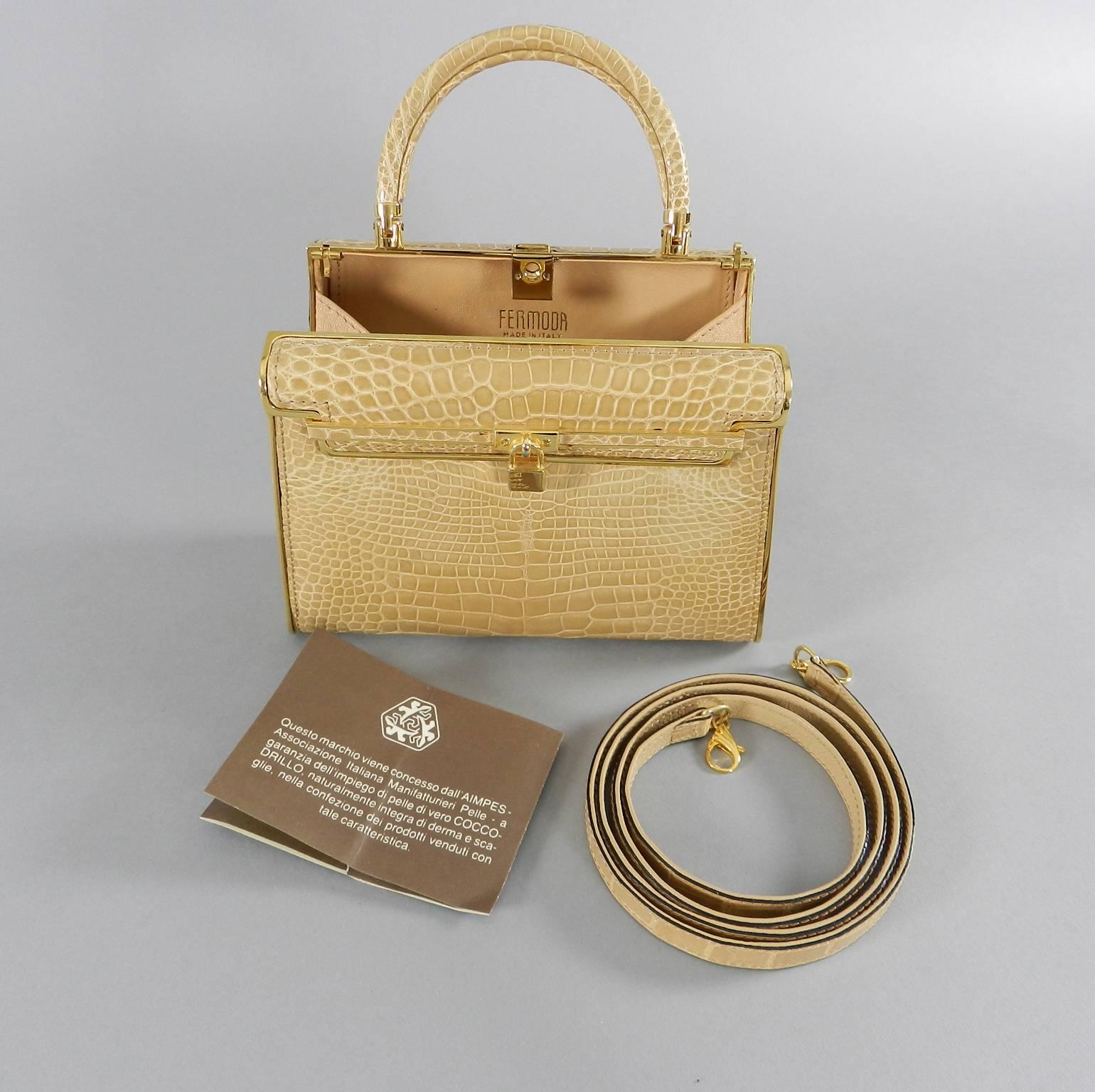 Fermoda Italy beige crocodile bag. Hard metal box bag style with shiny goldtone metal hardware. Excellent clean condition.  Shoulder strap can be tucked inside when used with top handle. Measures 7 x 5 x 2.5