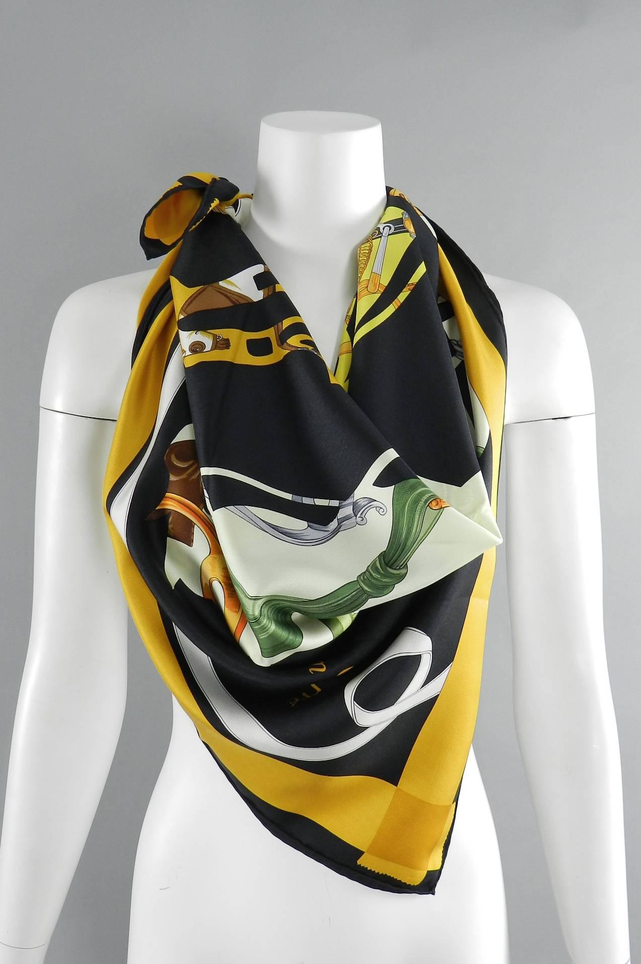 Hermes silk twill 90cm scarf - tout en Carre.  Artist is Bali Barret and year of production is 2006. Excellent clean condition with no flaws. Primary colors are yellow, black, mustard, and green. Carriage and horse design.

We ship worldwide.