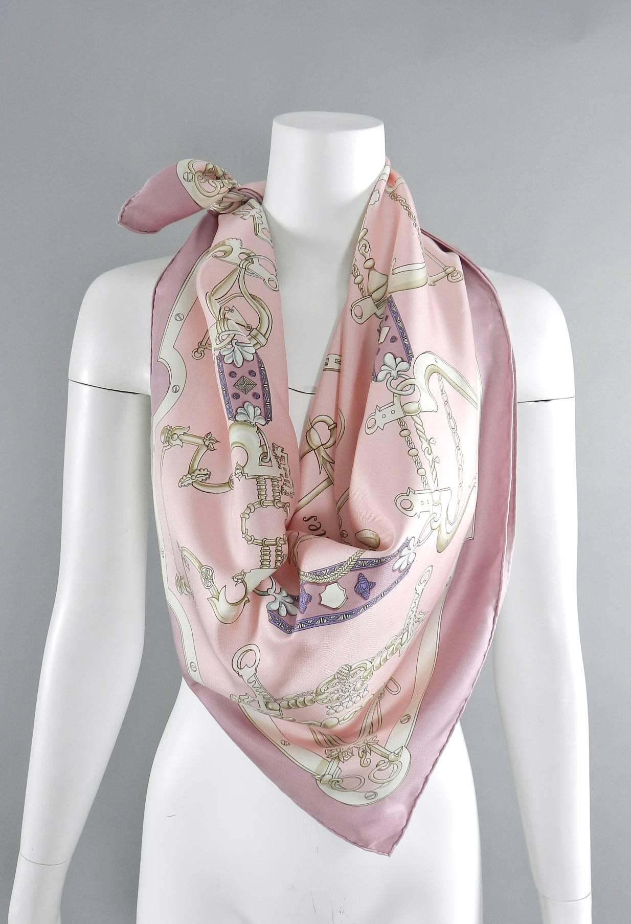 Hermes silk twill 90cm scarf - Mors et Gourmettes in box.  Artist H. d'Origny.  Primary colors are ivory, white, light pink, and darker quartz pink.  Excellent condition. 

We ship worldwide.