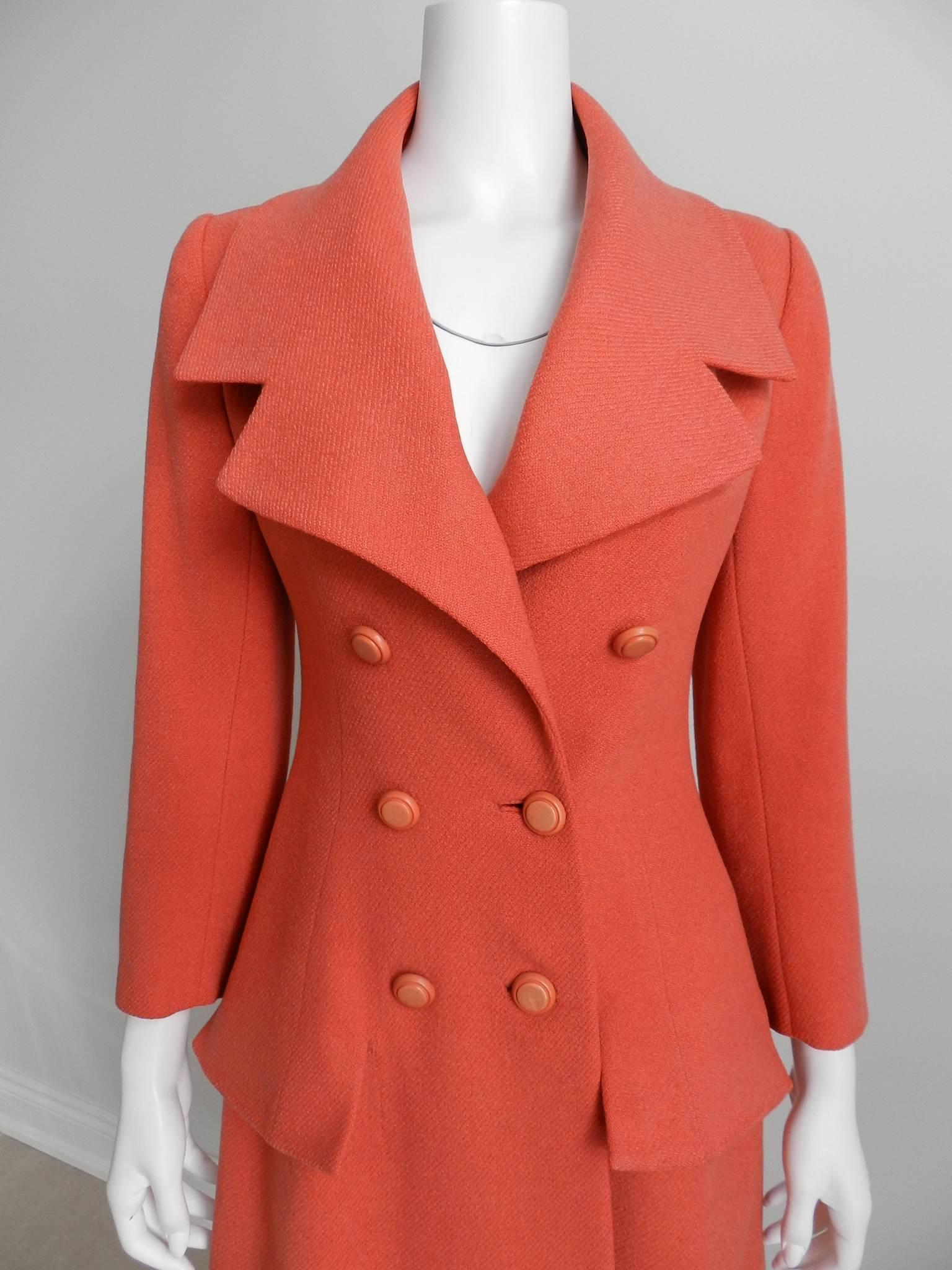 Christian Dior vintage salmon wool coat. Circa late 1950's / early 1960's. Label reads "Christian Dior original in Canada Excusive with Holt renfrew and Co. Limited."  Garment measures 37" at bust and is recommended for about