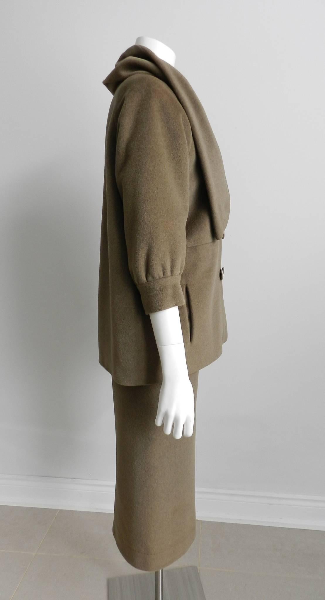Nina Ricci vintage early 1960's cashmere skirt suit. Mossy green or brownish olive color.  Velvet waistband on skirt and acetate lined. Skirt waist measures 31" (Unsure if original waistband was replaced with velvet waistband to allow for