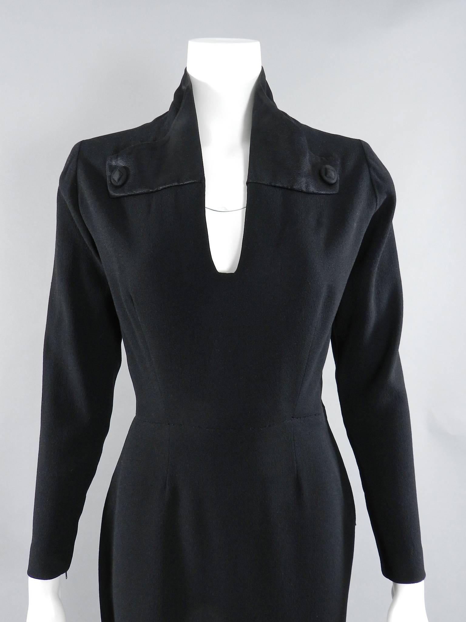 Vintage Pierre Balmain haute couture dress circa early 1950's. Black unlined wool trimmed with finely ribbed silk satin. Metal side zipper and at cuffs. 25