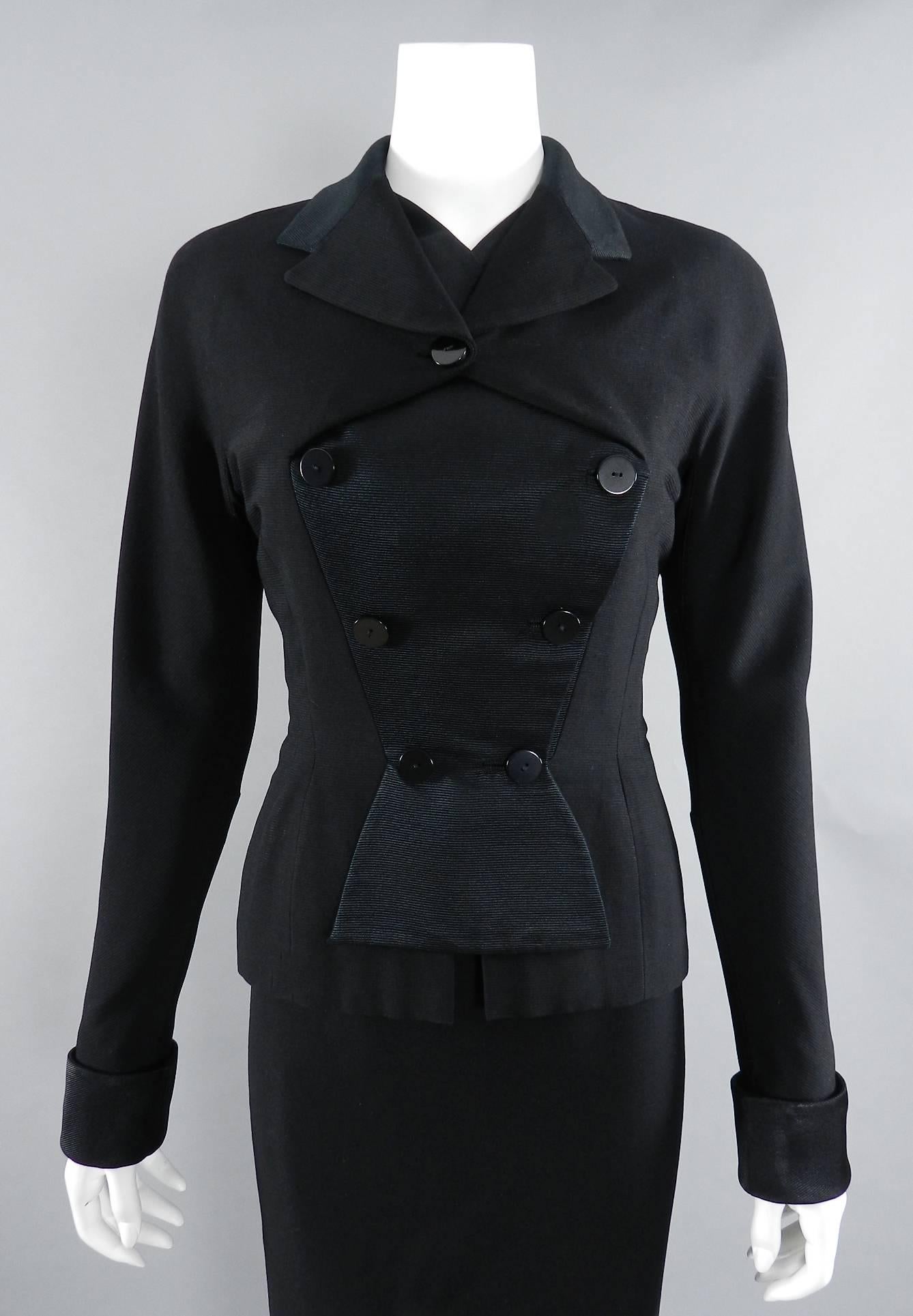 Pierre Balmain circa early 1950's skirt suit. Black finely ribbed wool with silk satin contrast. unique fold over design at front bust, french cuffs, pencil skirt with off-centre back zipper. Skirt waist 25