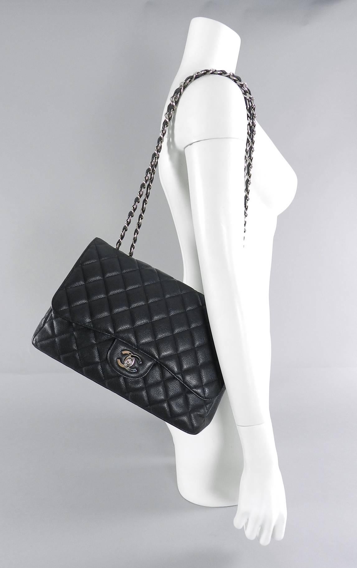 Chanel Caviar leather single flap Jumbo Classic Flap Bag with silver hardware.  Date code 12 series for production year 2008-9.  Includes all papers, authenticity card, duster, and box, and ribbon. Excellent pre-owned. Body of bag measures 30 x 20 x