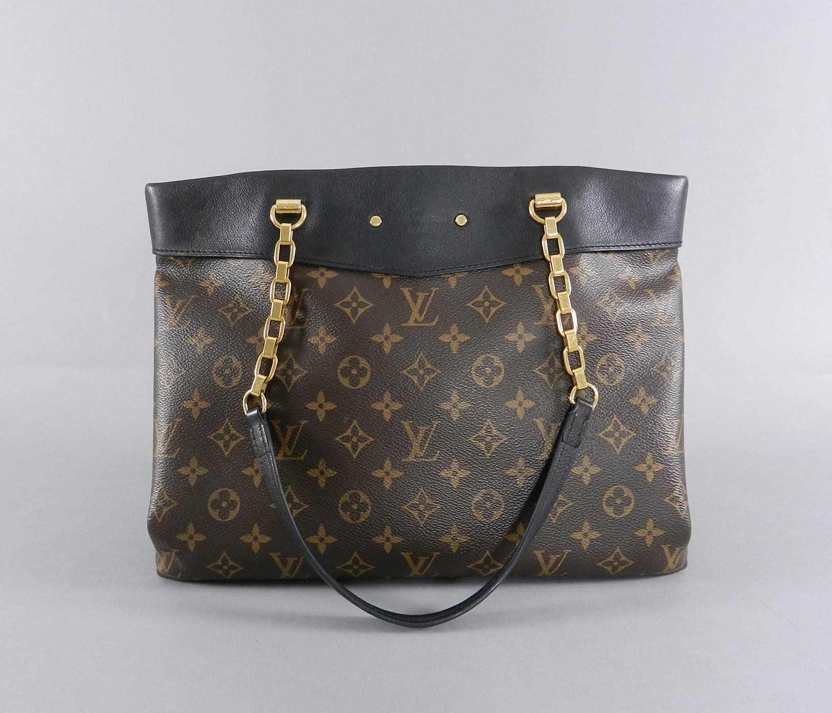 Louis Vuitton Pallas Shopper Bag - Monogram canvas and black.  Measures 13.5 x 9.75 x 6" with a 9.75" drop.  Excellent pre-owned condition.  Clochette is missing, some wear to metal bottom feet and metal interior zipper pull as pictured.