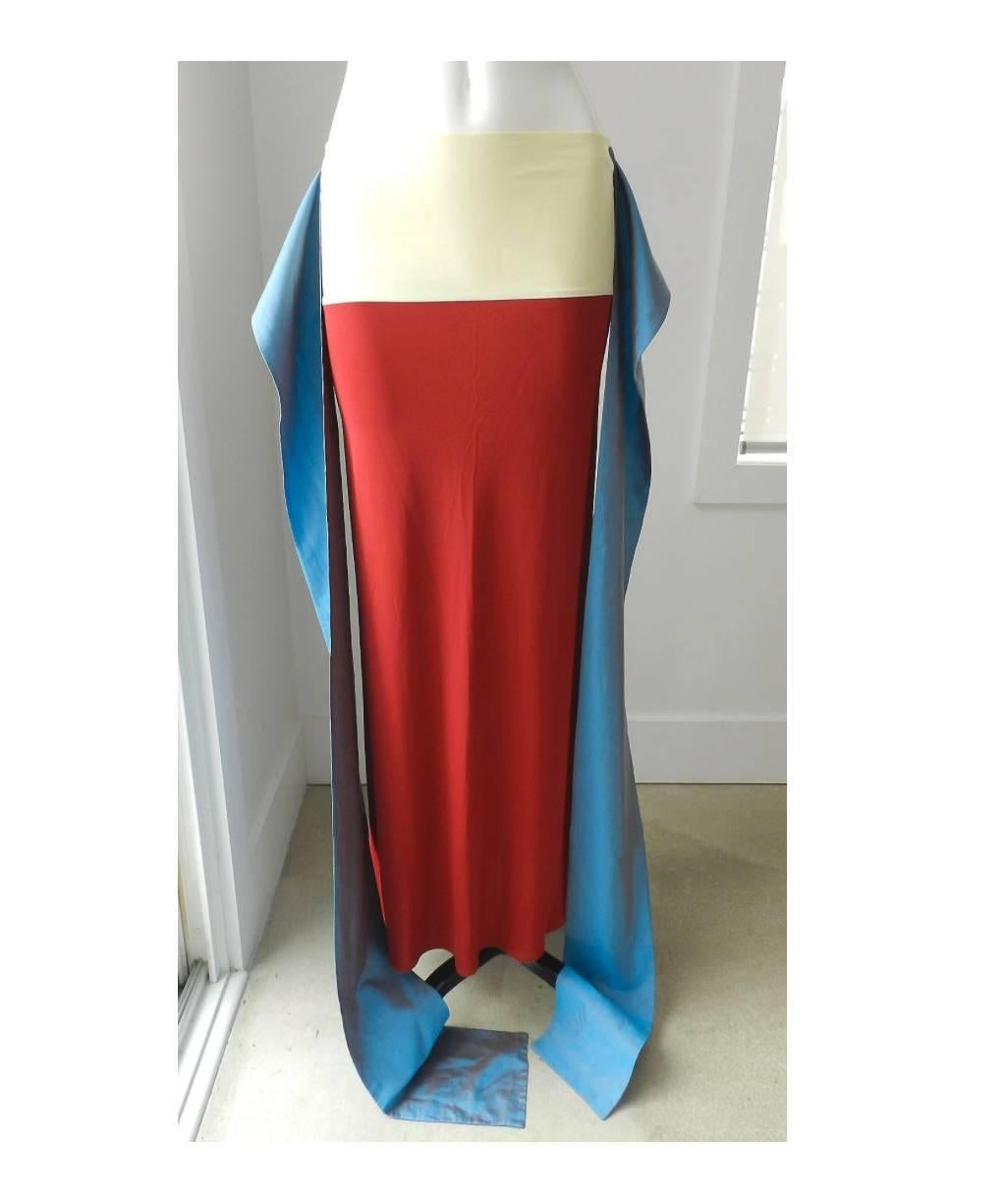 Jean Paul Gaultier red silk jersey tube skirt. Light fluid jersey fabric with stretch ivory cotton waist and blue cotton sashes. Can be worn tied in various ways. Tagged size USA 8. Measures 30