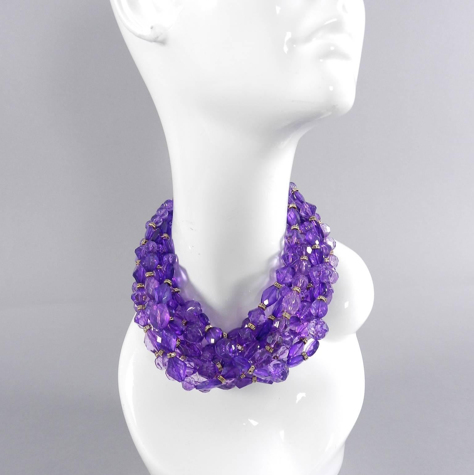 Christian Dior purple 10-strand choker necklace. Purple plastic faceted beads with rhinestone spacers. Metal toggle clasp closure.  Signed Christian Dior Boutique on hang tag. Excellent vintage condition. Measures 15" interior circumference