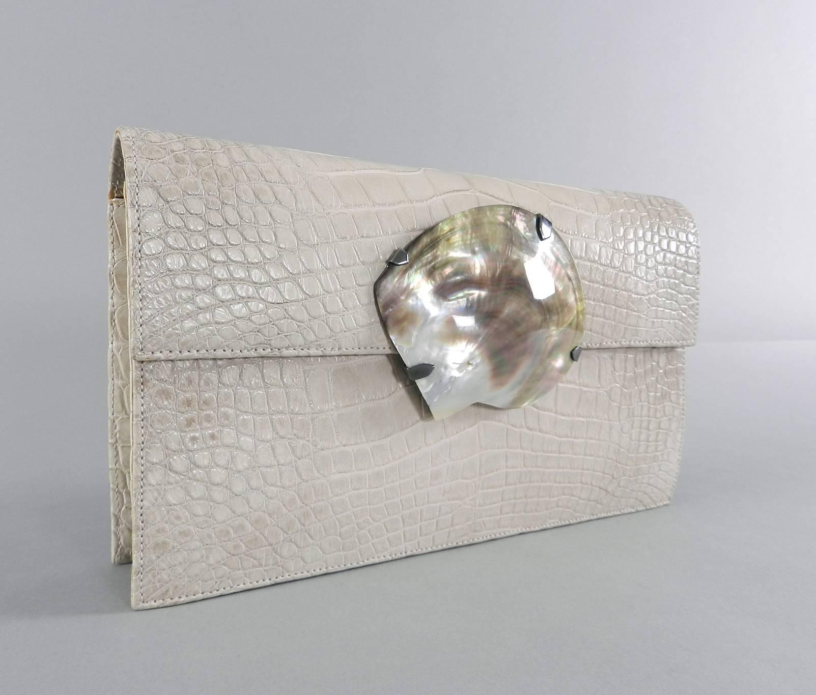 YSL Yves Saint Laurent Vintage Haute Couture Crocodile Clutch Bag with Abalone Shell.  Matte crocodile skin.  Color is a chalky light greyish beige / mushroom. Magnetic clasp closure, small zippered interior compartment, haute couture marked