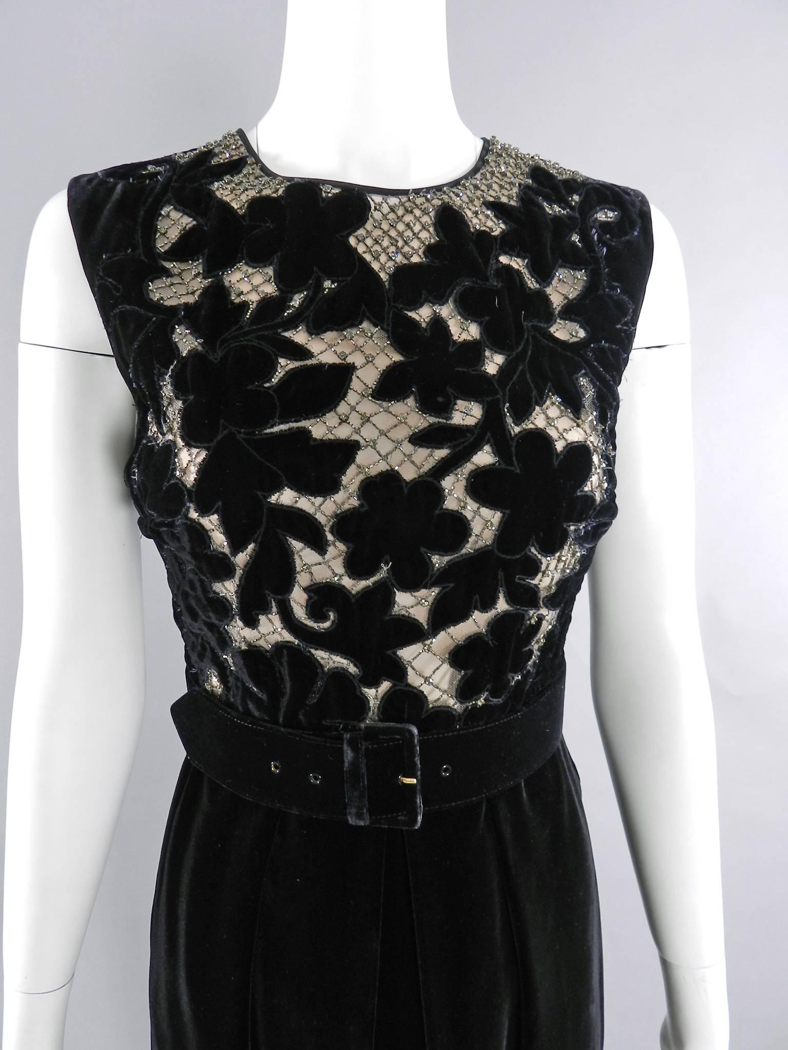 Valentino Black Velvet Cocktail Dress. Bodice has a cut-out lace design backed with net fabric and nude lining decorated with rhinestones. Centre back zipper, sleeveless design, wide belt. Excellent pre-owned condition.

Tagged size IT 44 (USA 8).