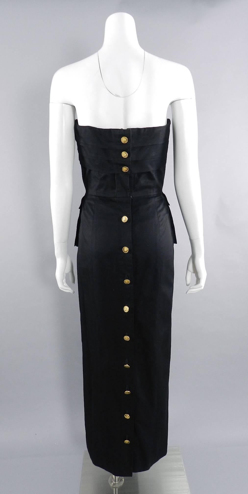 Chanel Vintage 1987 Black Strapless Cotton Dress with Wheat Buttons.  Boned corseted bodice, fastens down back with gold buttons, and has peplum side pockets. Excellent vintage condition. Size tag has been removed but is a FR 40 (USA 8). Garment