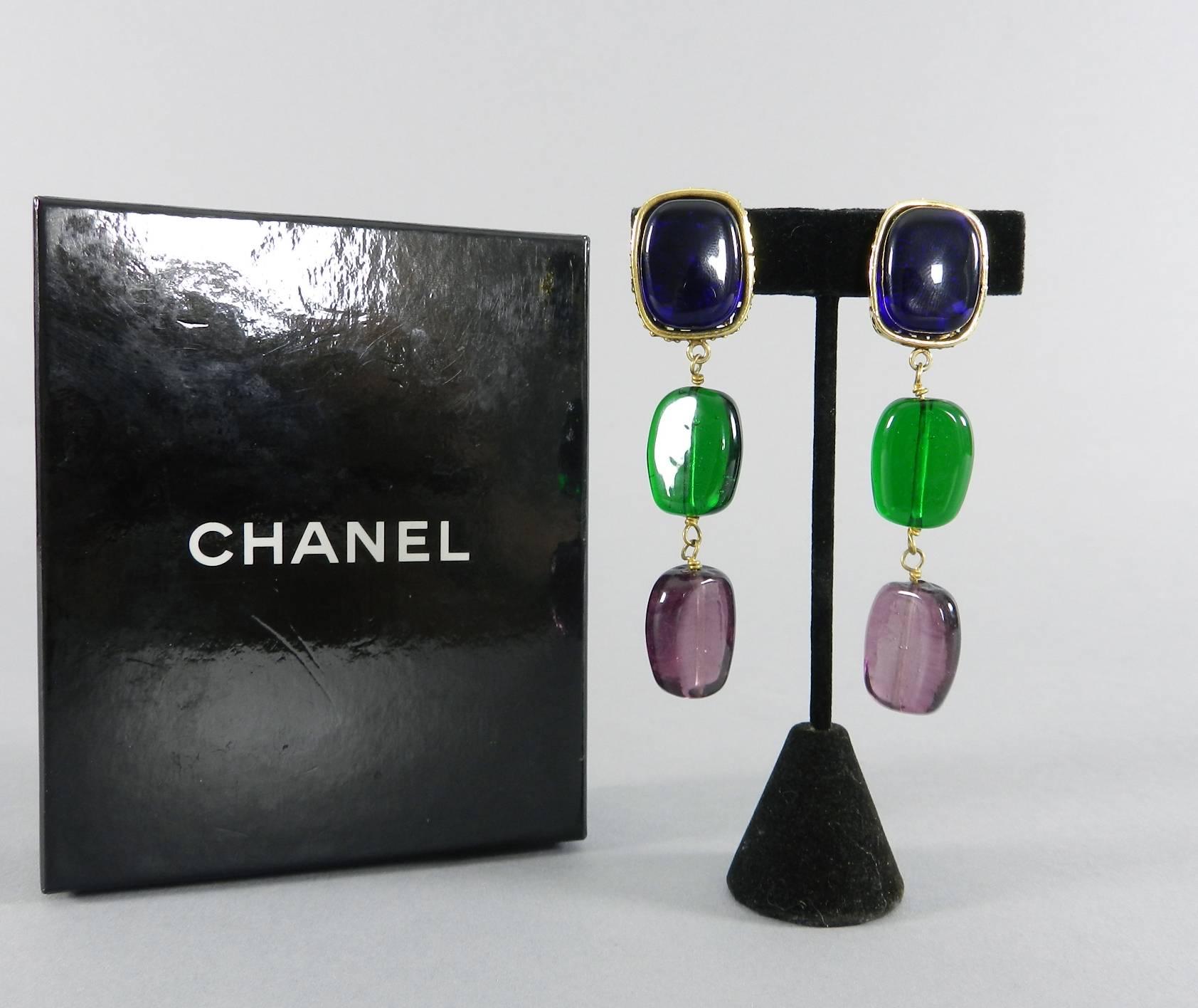 Chanel Vintage 1984 Gripoix Glass Drop Earrings.  Marked season 23 which was the first year that Victoire de Castellane designed jewelry for Chanel. Dark cobalt blue, green, and purple glass beads with gold gilt clips. Measures 3-1/8" long and