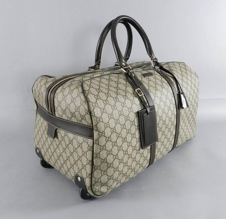 Gucci GG monogram Brown Canvas Duffle Rolling Luggage Carry on Travel Bag at 1stdibs