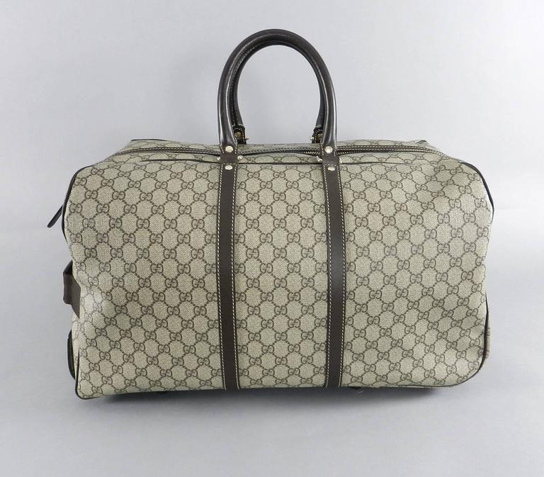 Gucci GG monogram Brown Canvas Duffle Rolling Luggage Carry on Travel