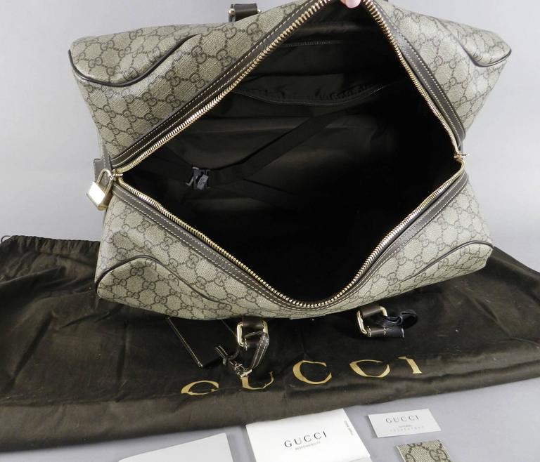Gucci GG monogram Brown Canvas Duffle Rolling Luggage Carry on Travel