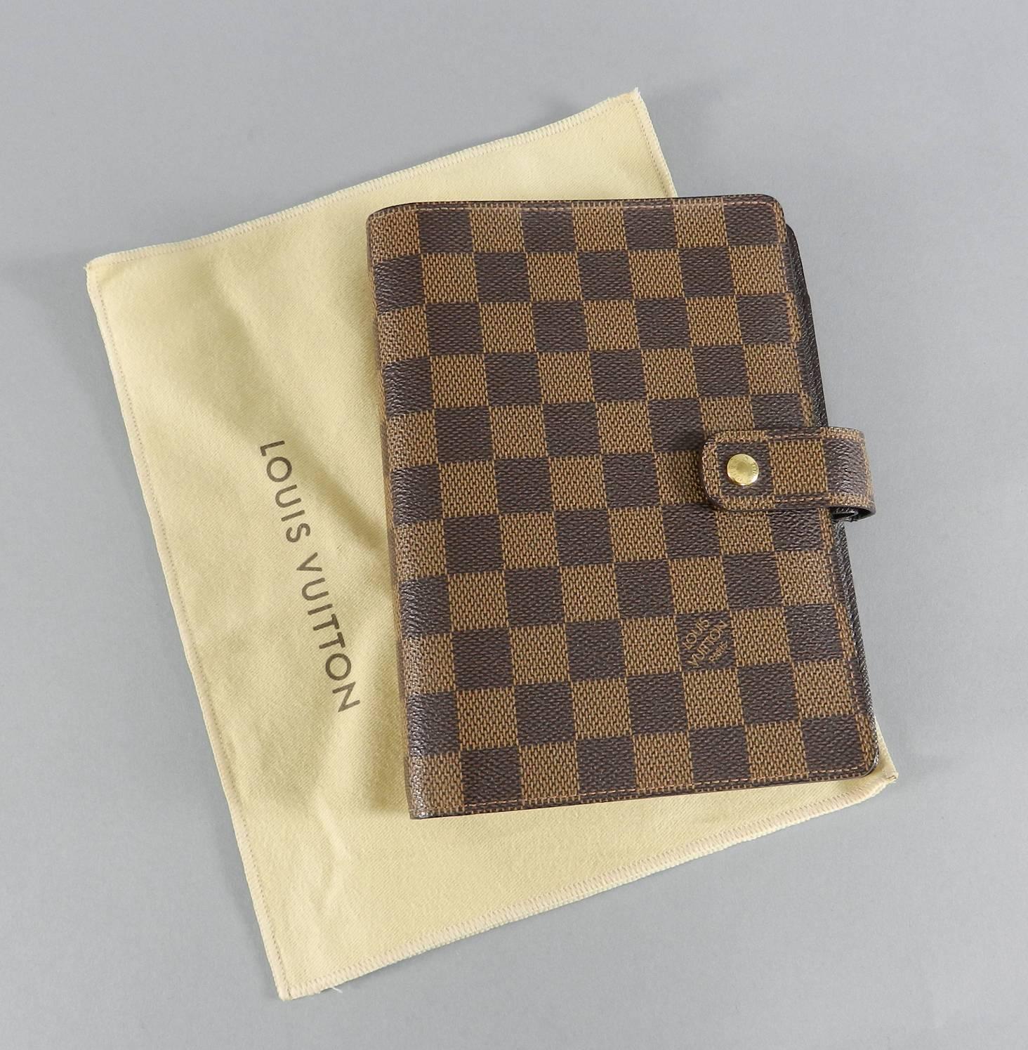 Louis Vuitton Damier Ebene Medium ring agenda cover.  Agenda paper insert can be purchased separately and are not included. Excellent pre-owned - Clean interior and exterior. Corners are excellent with no wear. Includes duster. Date code SP0072 for