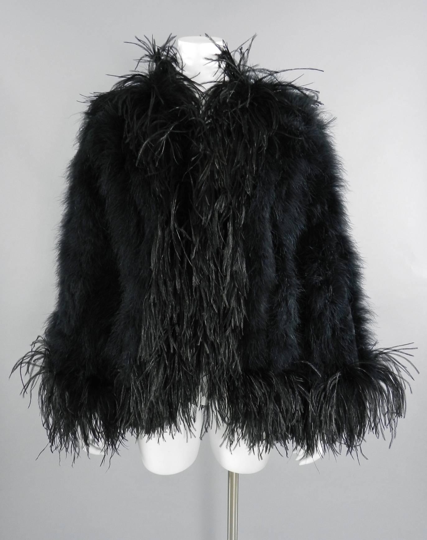 Yves Saint Laurent Vintage 1970's Maribou and Ostrich Feather Glam Jacket.  Body is decorated with maribou feathers on a flowing acetate body and trimmed with longer ostrich plume at edges.  Jacket is a light weight evening jacket and is worn open