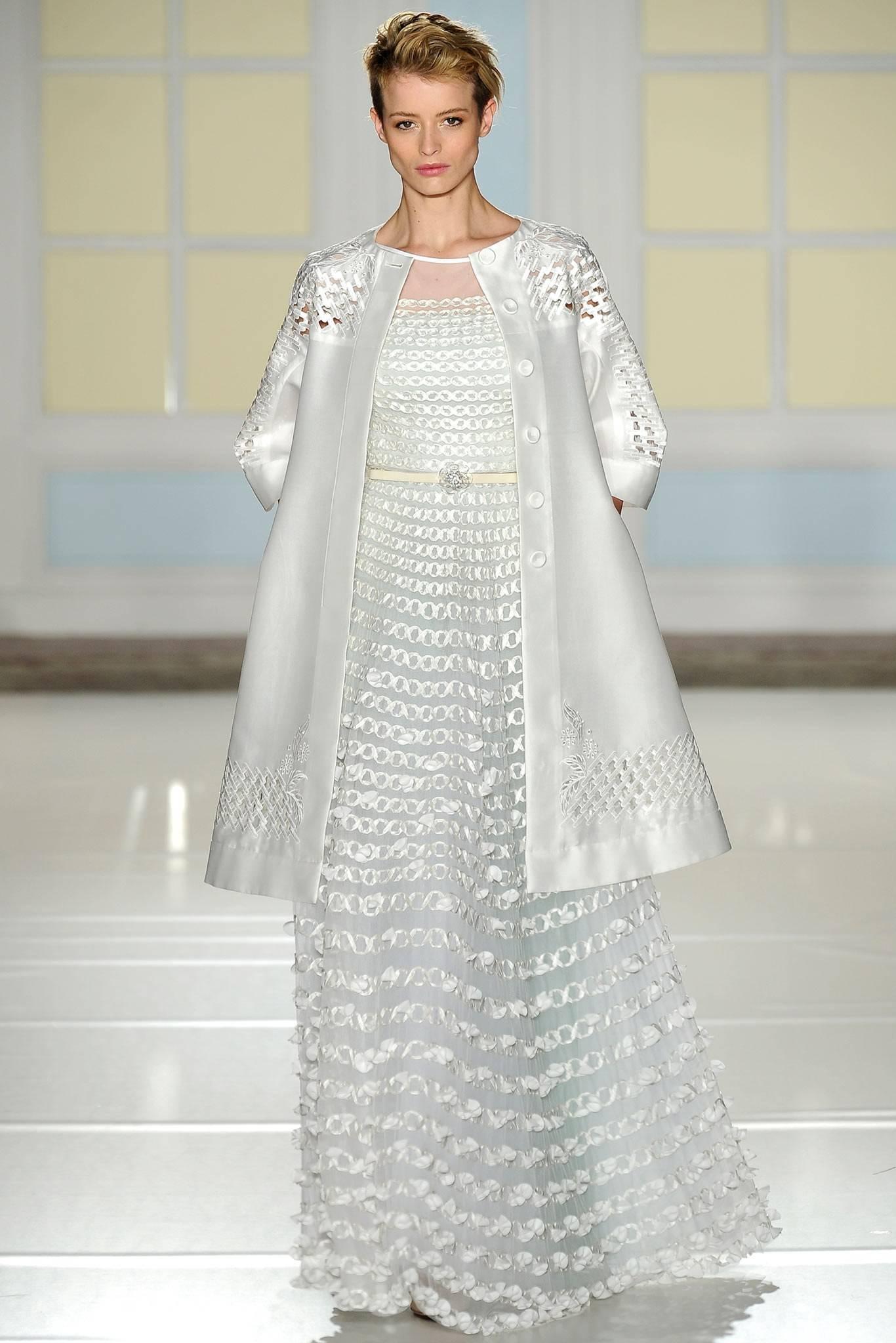 Temperley London Runway White Broderie Anglaise Dress / Coat.  Buttons all the way down front so can be worn open as a full swing style coat or can be worn belted. Belt can be worn threaded through slits at side waist so back profile has a full