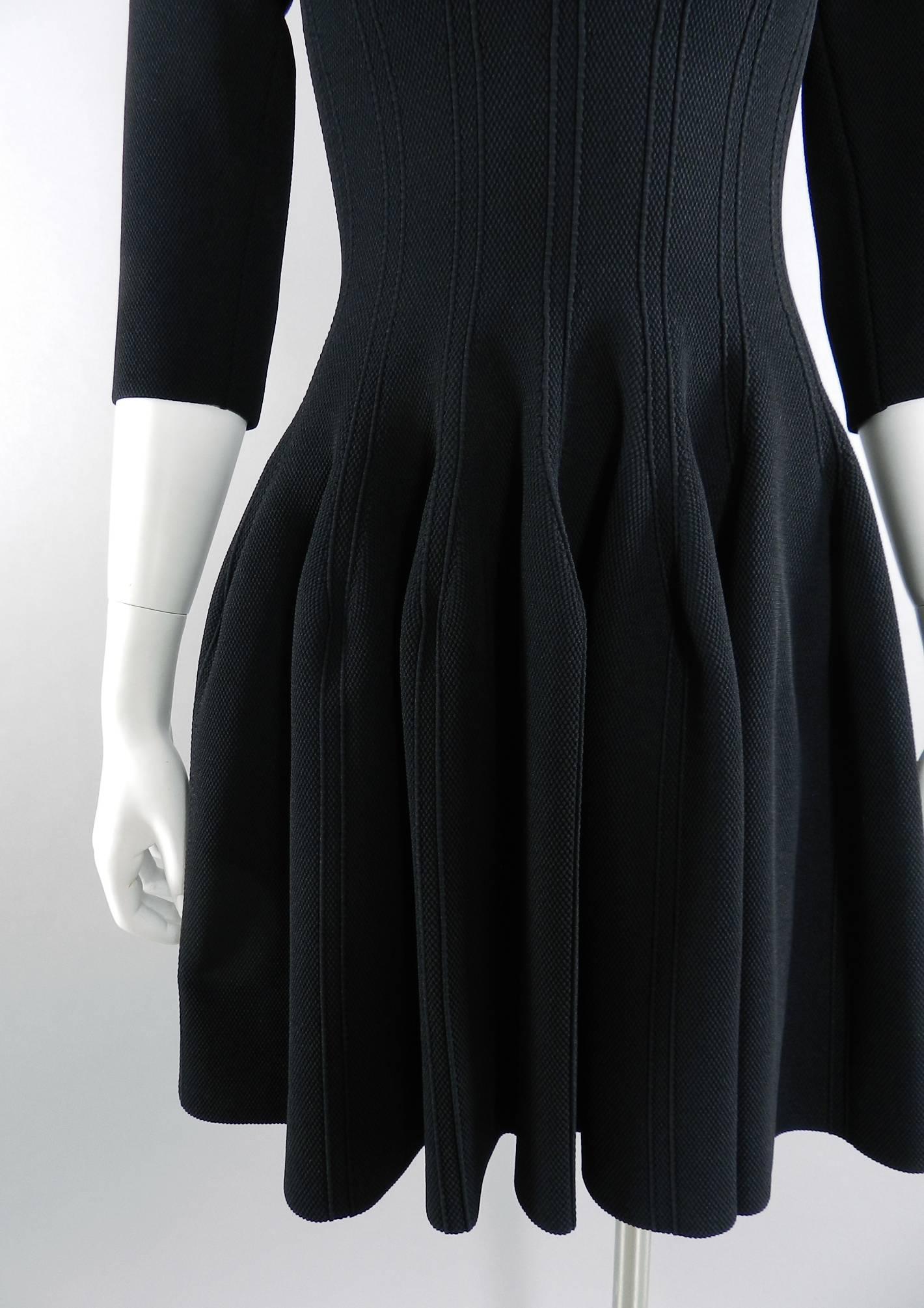 Alaia Black Fit and Flare Skater Dress.  Stretch knit jersey fabric with 3/4 length sleeves, fitted bodice, and full skirt. Tagged size FR 40 but Alaia runs small and this is best for USA size 4/6 (size S). Will fit 34" at bust, 24" waist