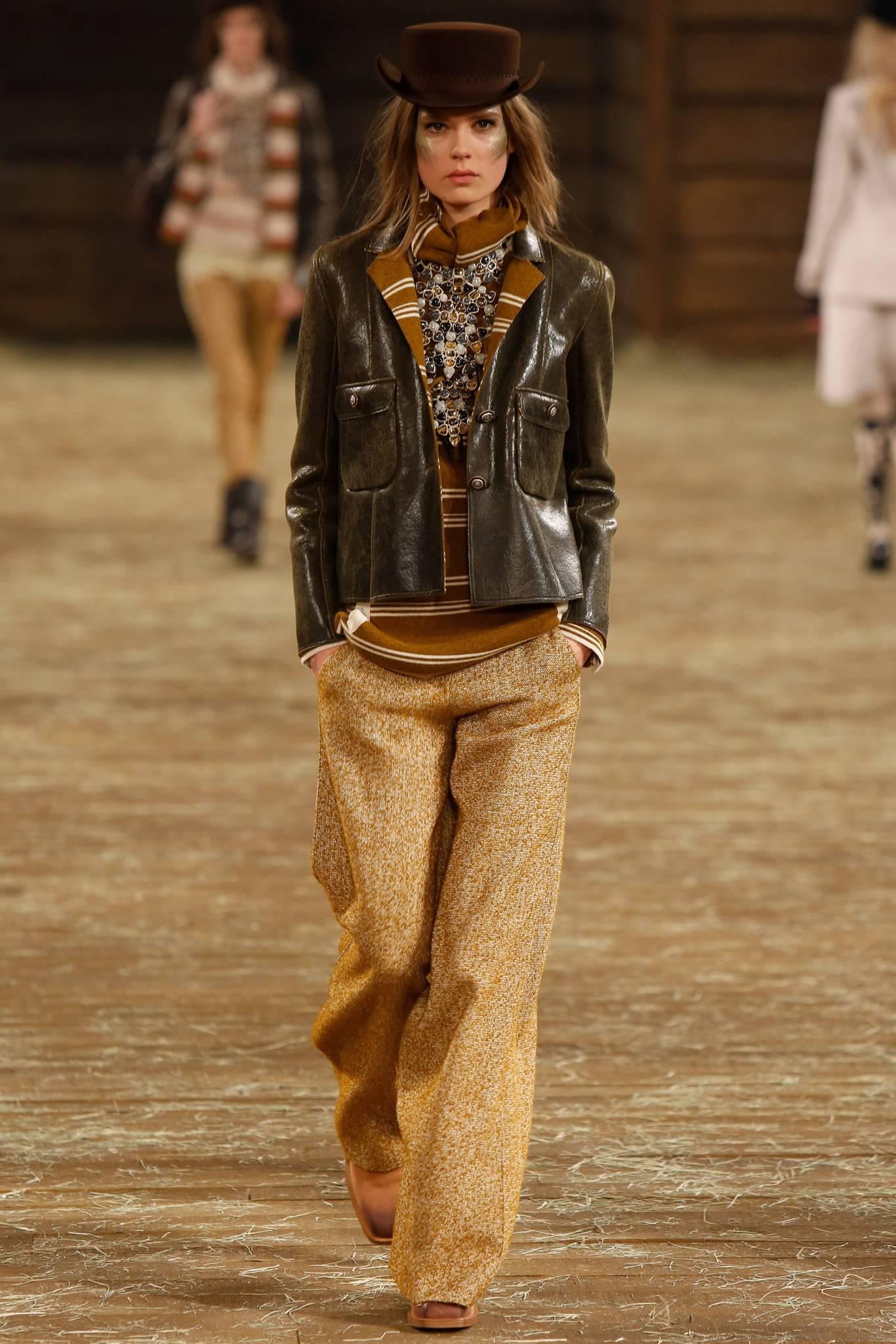 Chanel Paris Dallas 14A 2014 Pre-fall Runway Brown Jacket. 100% cashmere mustard and ivory striped body that is coated to create a brown leather look. Accented with wood star buttons. Tagged size FR 38 (USA 6).  Garment bust measures 38